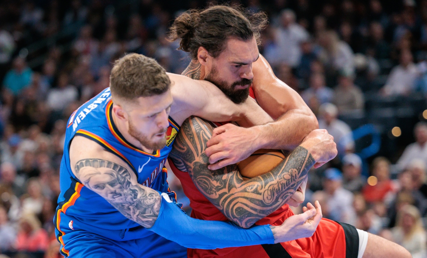OKLAHOMA CITY, OKLAHOMA - OCTOBER 21: Steven Adams #12 of the Houston Rockets keeps control of the ball from Isaiah Hartenstein #55 of the Oklahoma City Thunder during the second half at Paycom Center on October 21, 2025 in Oklahoma City, Oklahoma. NOTE TO USER: User expressly acknowledges and agrees that, by downloading and or using this photograph, User is consenting to the terms and conditions of the Getty Images License Agreement. (Photo by William Purnell/Getty Images)