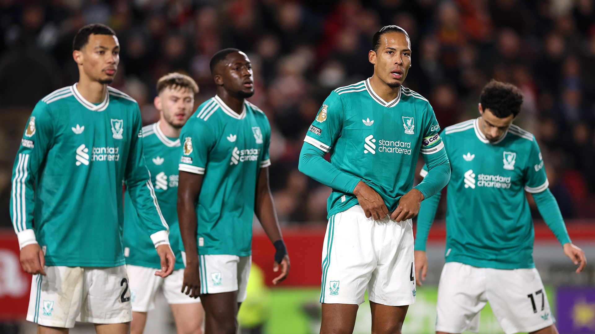 Virgil van Dijk of Liverpool looks on alongside teammates during the Premier League match between Brentford and Liverpool at Gtech Community Stadium on October 25, 2025 in Brentford, England.