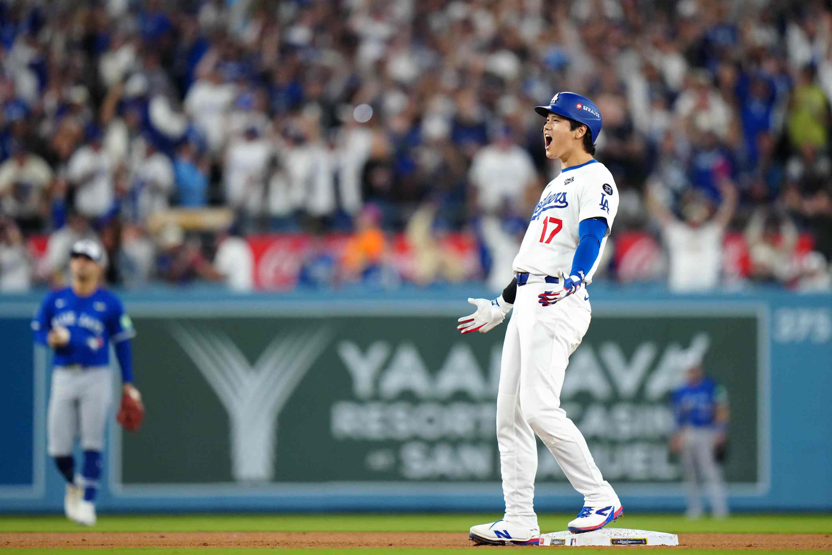 Shohei Ohtani #17 of the Los Angeles Dodgers reacts after hitting an RBI double