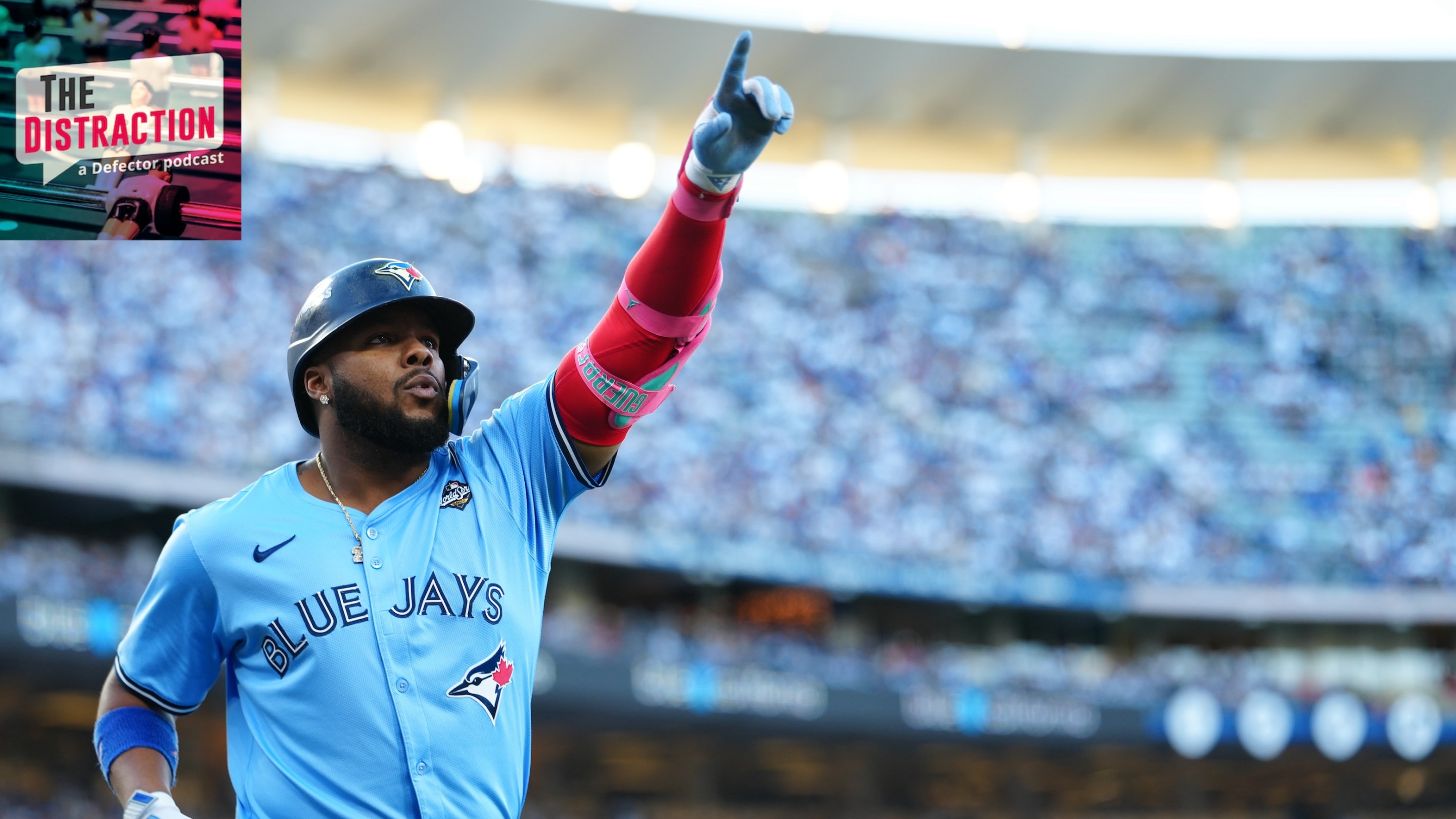 Vladimir Guerrero Jr. of the Toronto Blue Jays celebrates after hitting a solo home run in the first inning during Game Five of the 2025 World Series. The Distraction logo is at upper left and the light above the stadium is lovely.