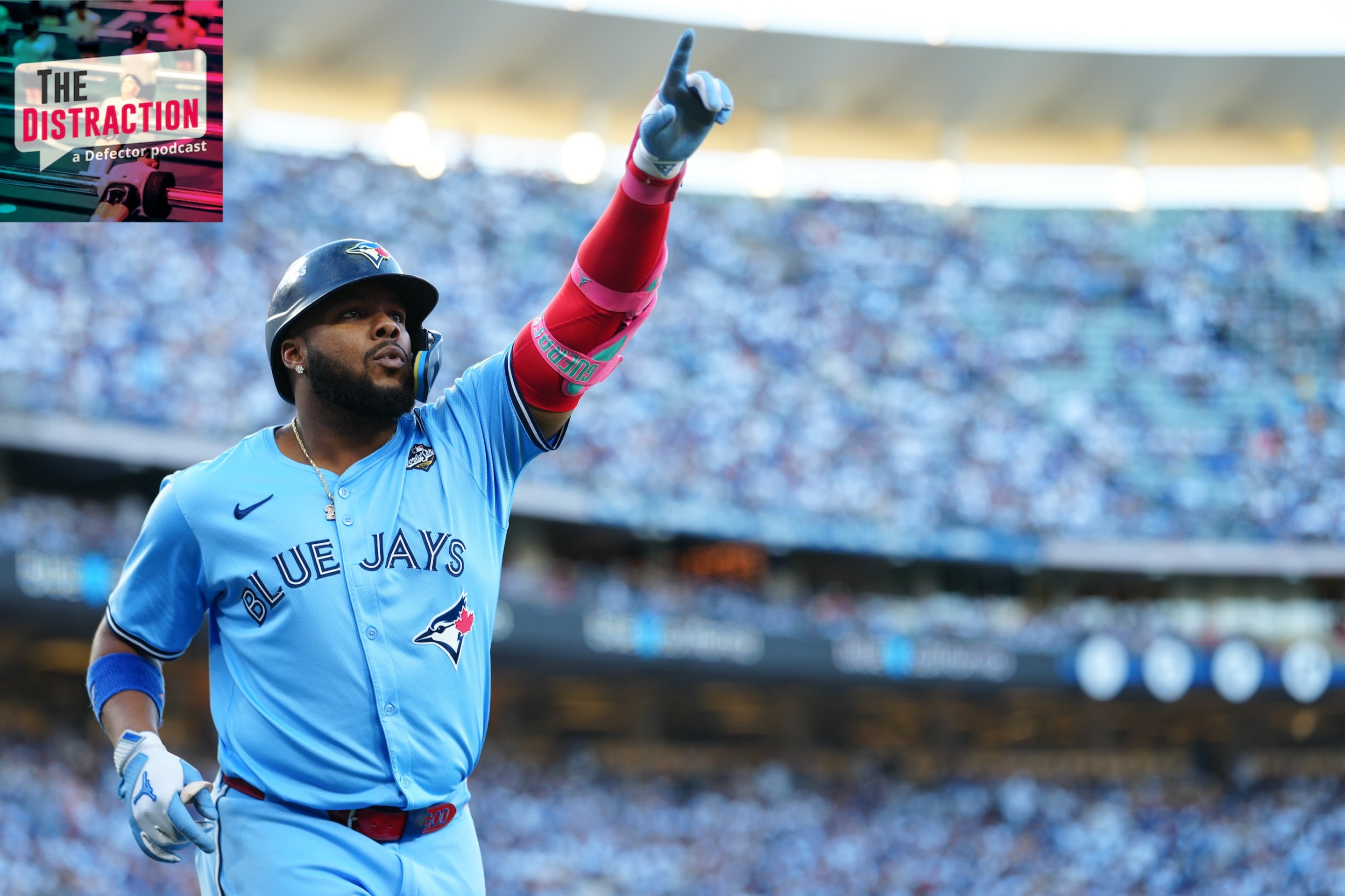 Vladimir Guerrero Jr. of the Toronto Blue Jays celebrates after hitting a solo home run in the first inning during Game Five of the 2025 World Series. The Distraction logo is at upper left and the light above the stadium is lovely.
