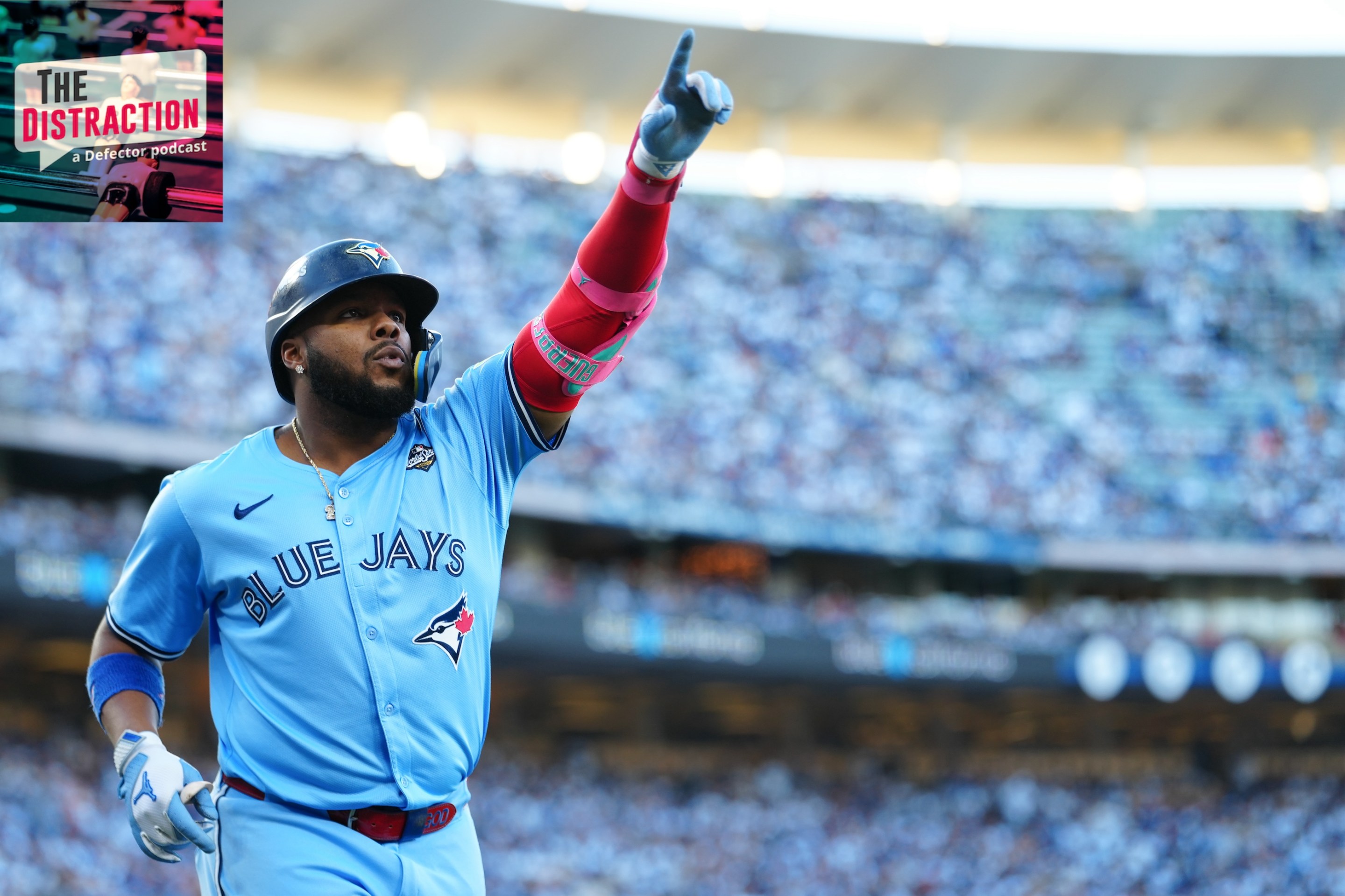 Vladimir Guerrero Jr. of the Toronto Blue Jays celebrates after hitting a solo home run in the first inning during Game Five of the 2025 World Series. The Distraction logo is at upper left and the light above the stadium is lovely.