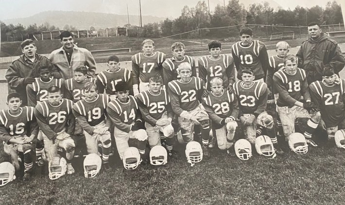A photo of Mike Lucido playing youth football while he lived in Germany. He's in the back row, wearing No. 10. He's the biggest kid on the team.