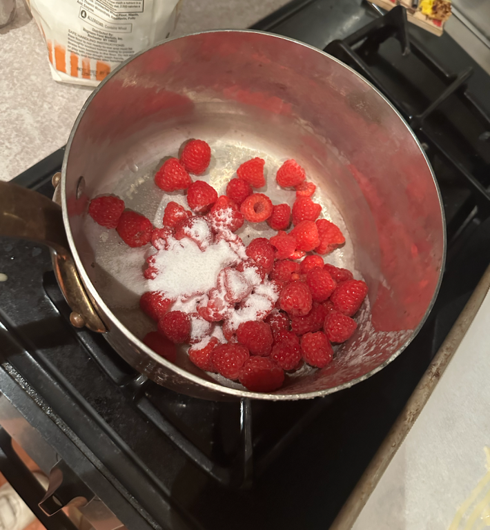 raspberries in a pot with sugar