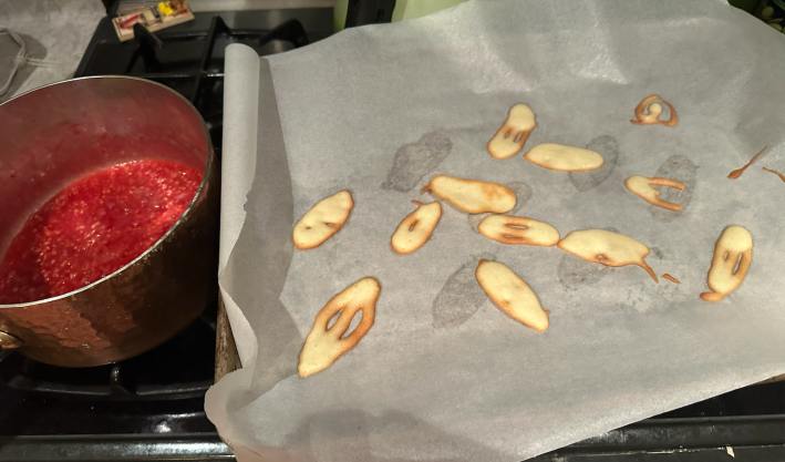 cooked "leves" next to rasperries on stove