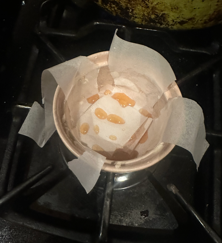 tiny drops of syrup in the bottom of a ramekin