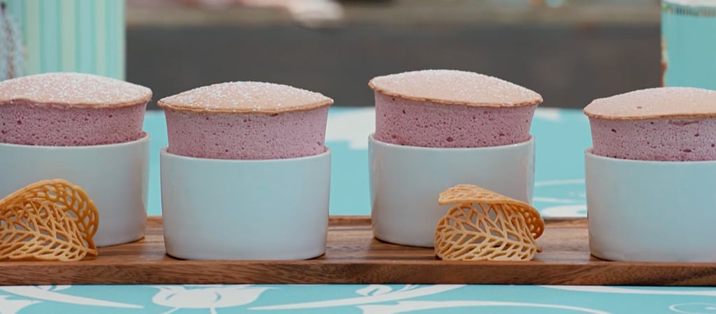 four nicely risen pink souffles
