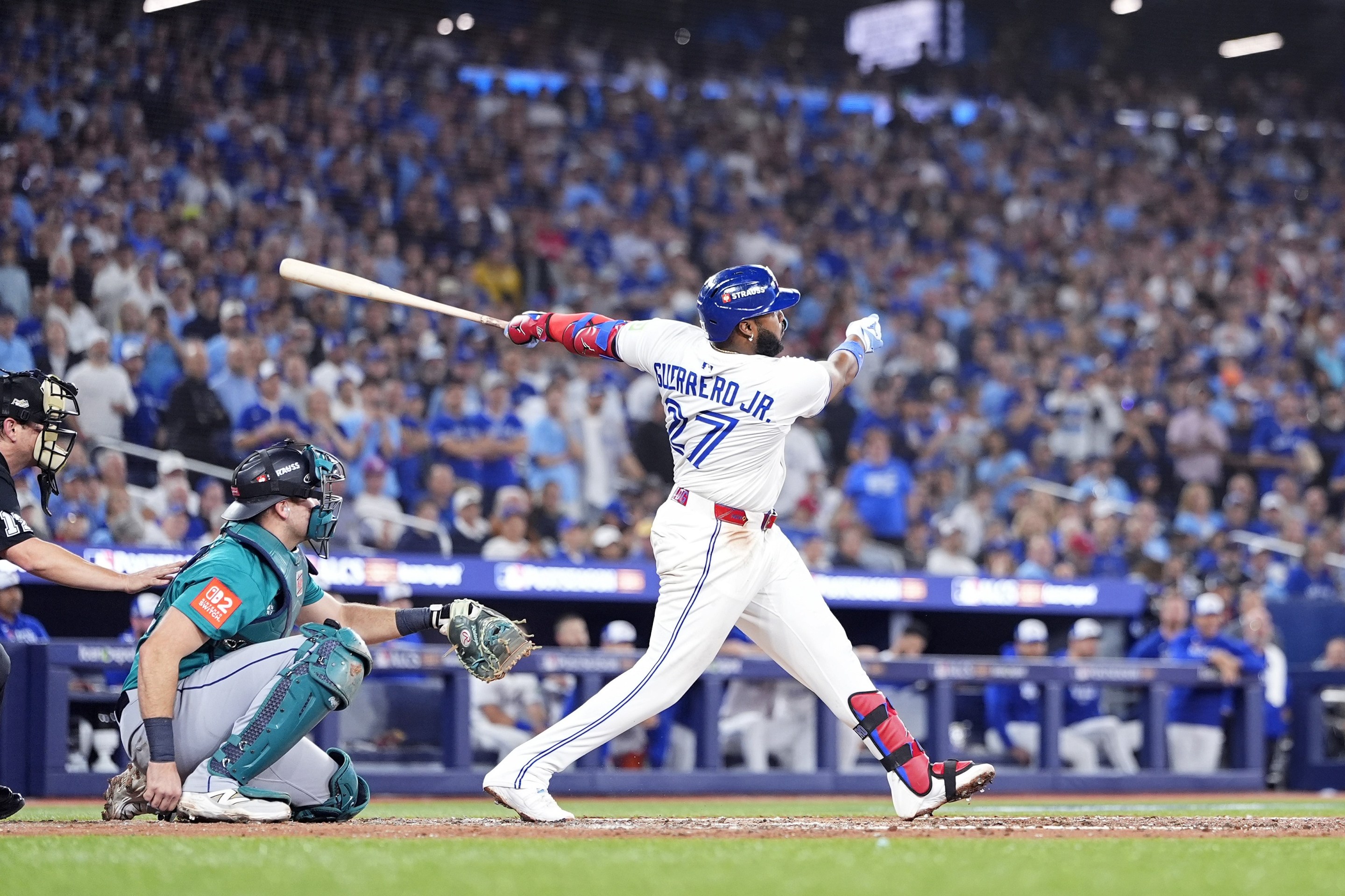 Vladimir Guerrero Jr. #27 of the Toronto Blue Jays hits a home run against the Seattle Mariners.