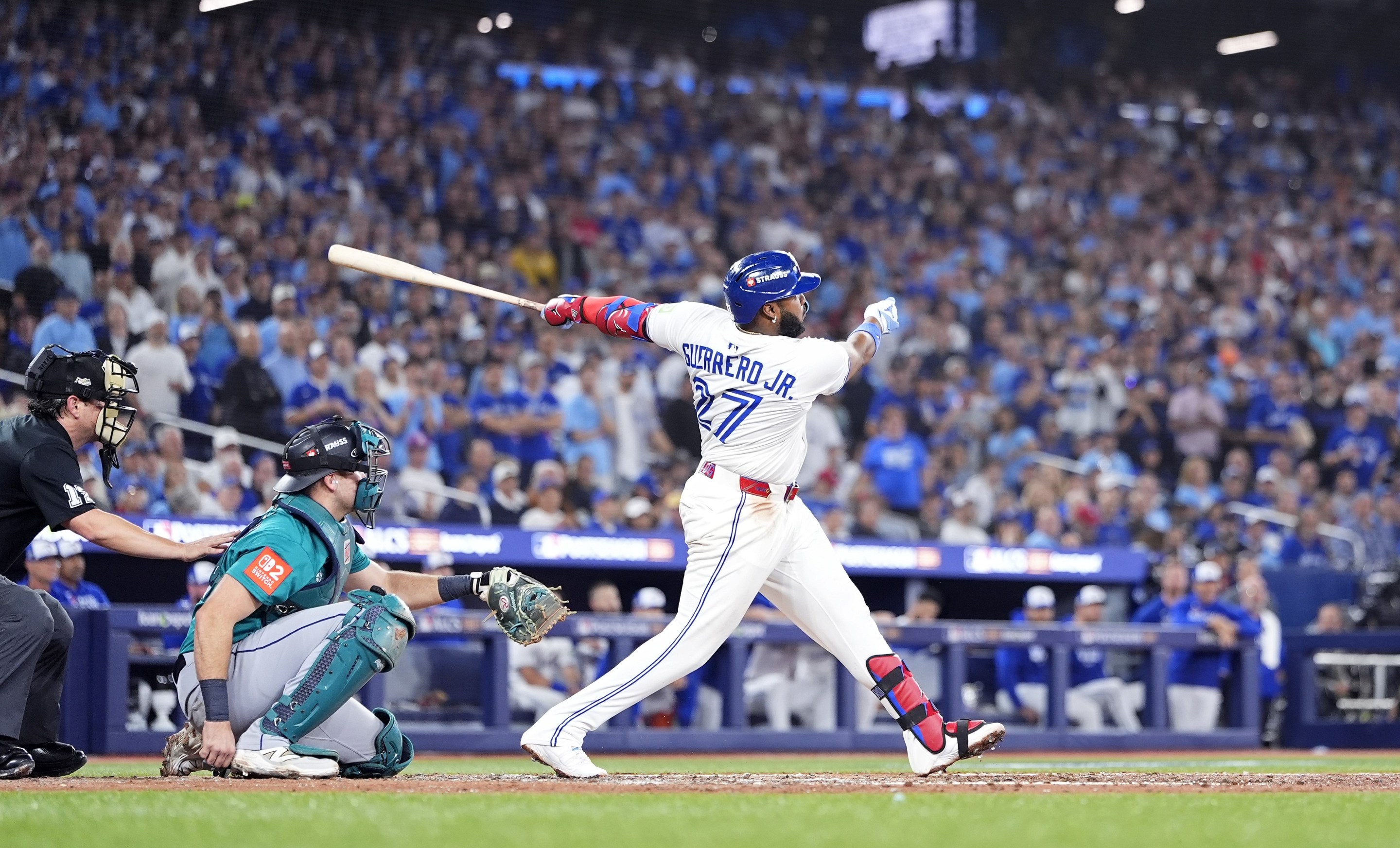 Vladimir Guerrero Jr. #27 of the Toronto Blue Jays hits a home run against the Seattle Mariners.