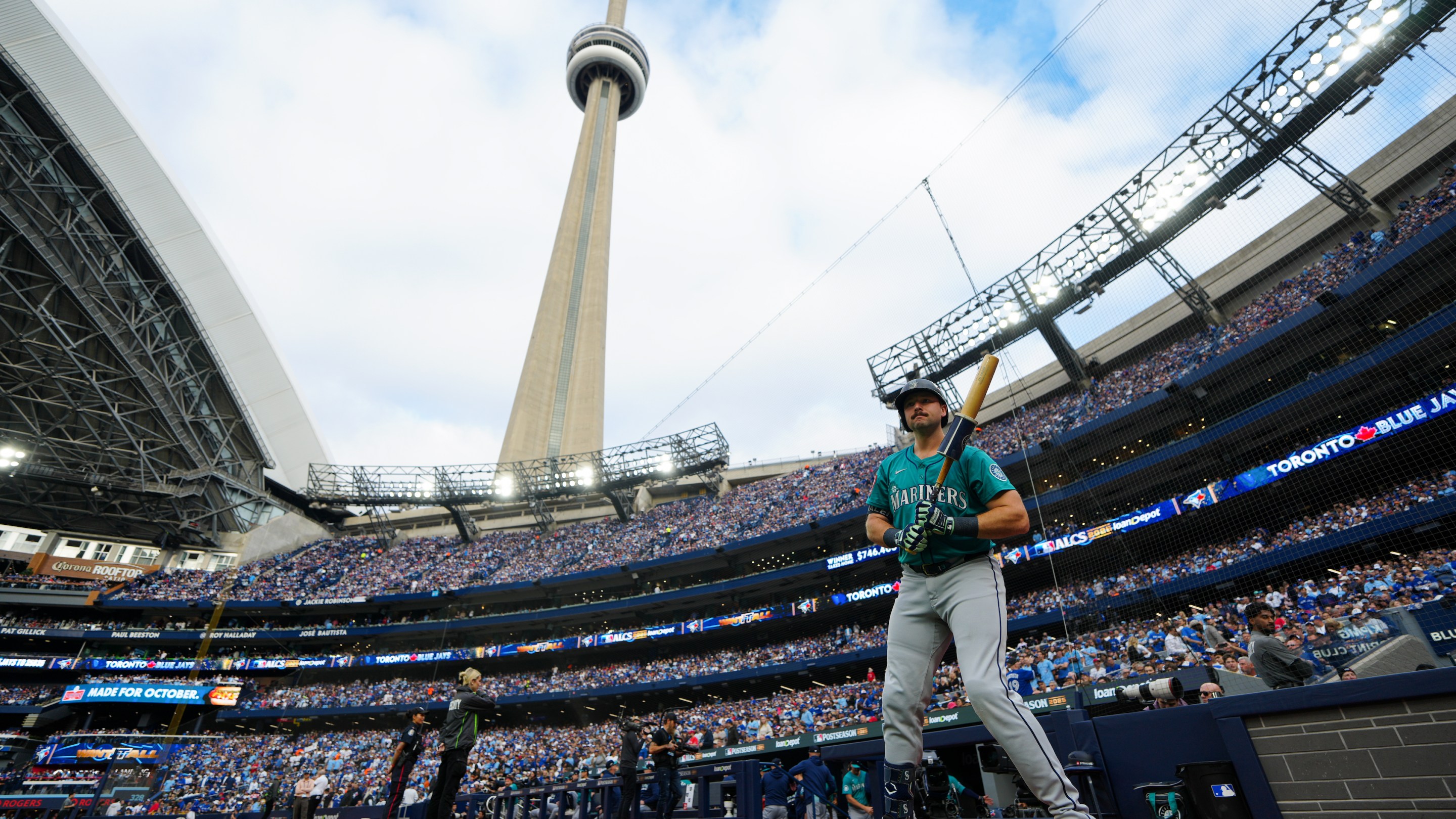 Cal Raleigh #29 of the Seattle Mariners prepares to bat in the first inning, in front of the backdrop of the CN Tower.