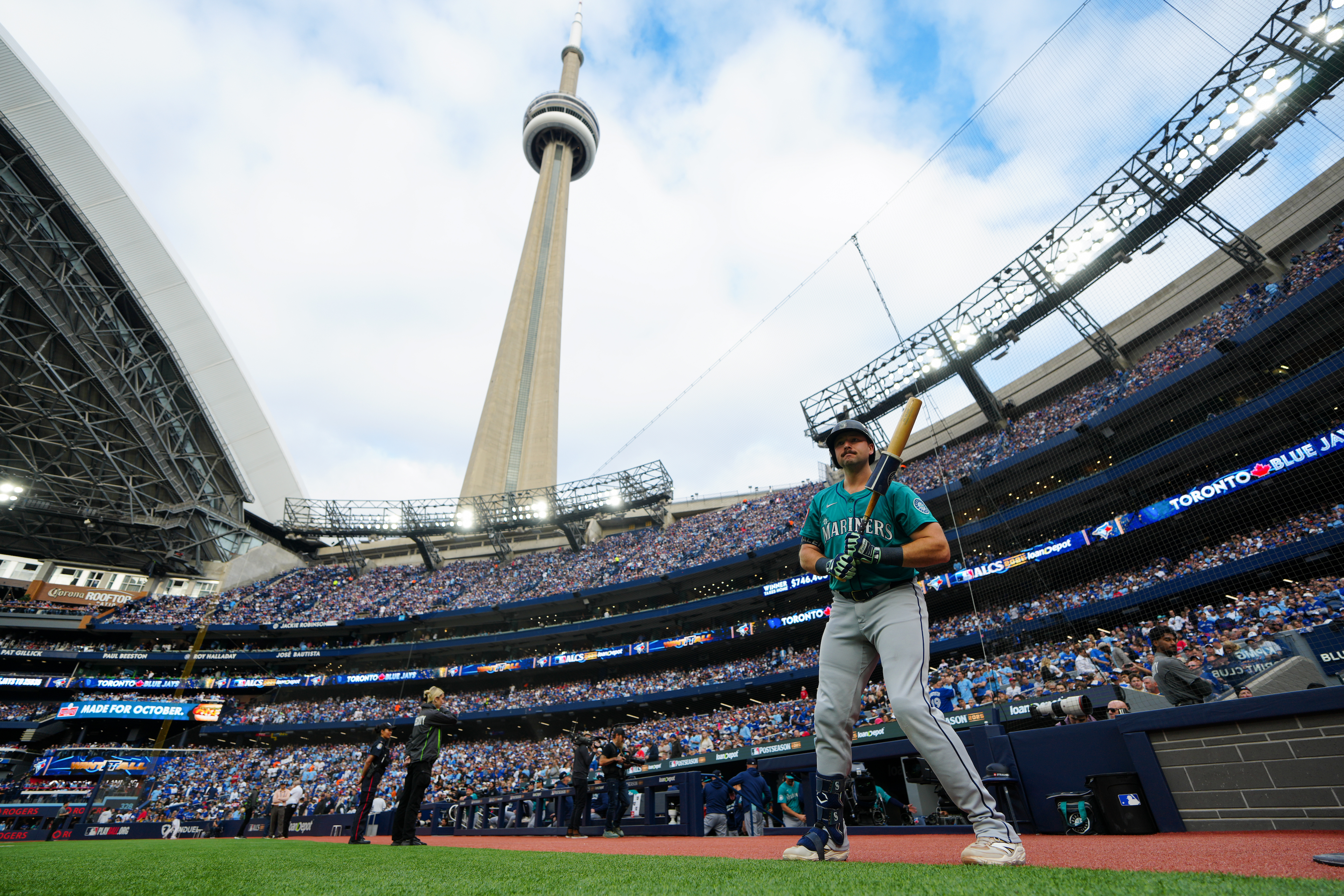 Cal Raleigh #29 of the Seattle Mariners prepares to bat in the first inning, in front of the backdrop of the CN Tower.