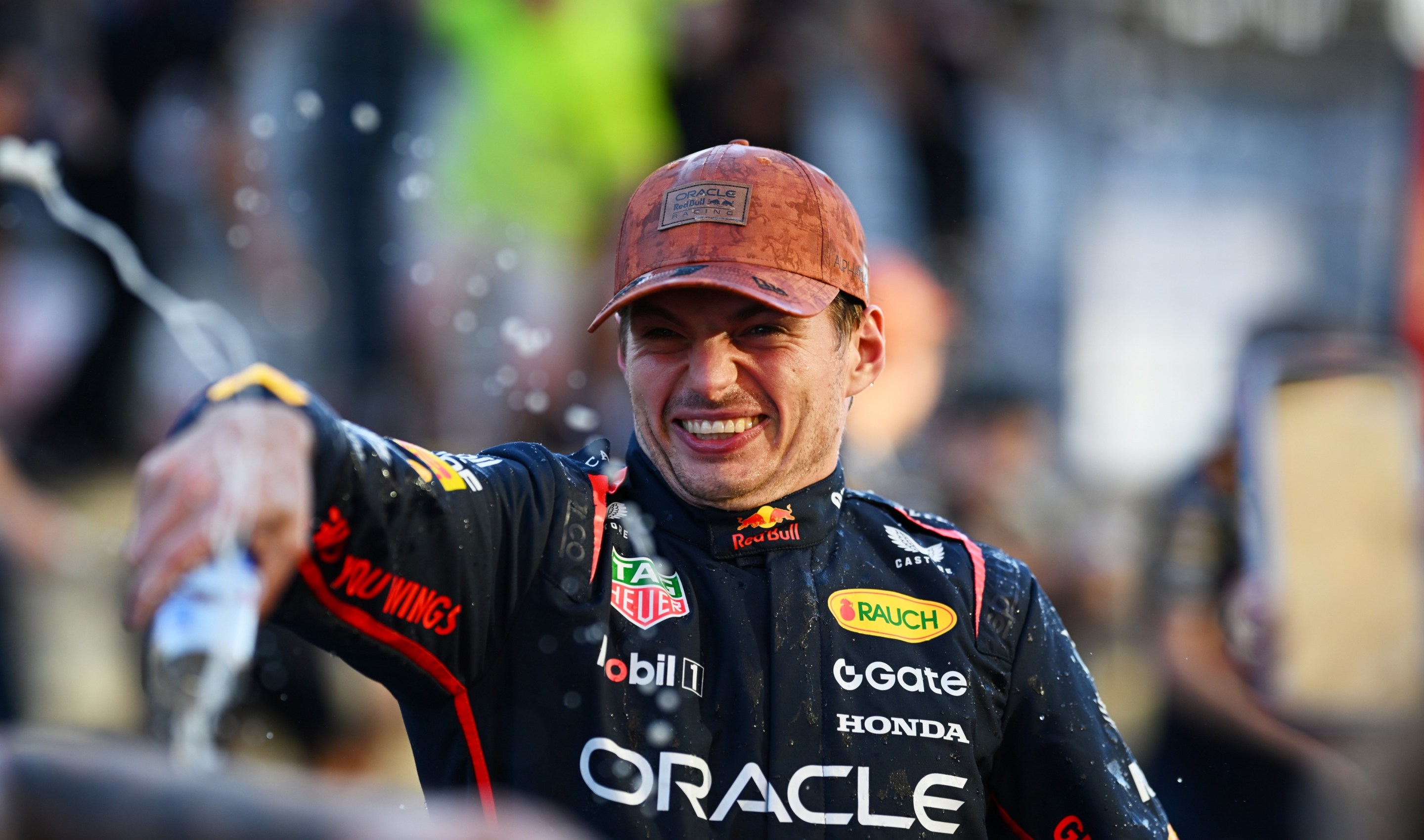 Race winner Max Verstappen of the Netherlands and Oracle Red Bull Racing celebrates victory with his team.