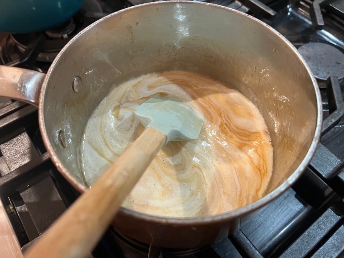 Cream and butter melt in reduced cider syrup.
