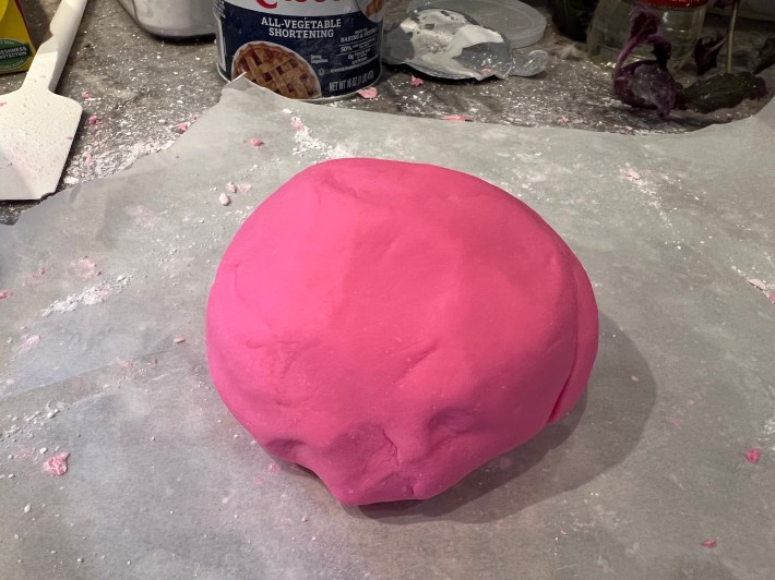 The fondant is now a smooth pink ball.