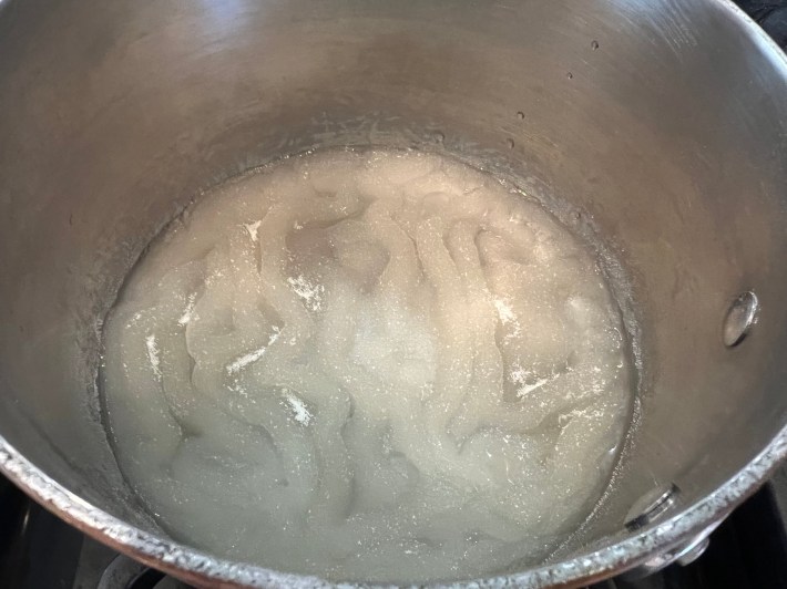 Gelatin melts in a mixture of water and corn syrup.