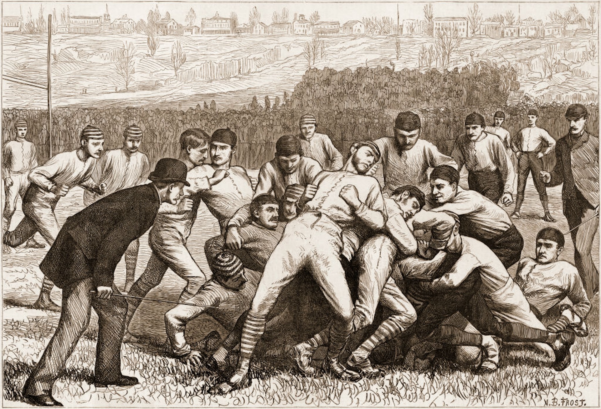 Football teams from the schools of Yale and Princeton playing a match on Thanksgiving Day afternoon that ended in a tie score, November 1879. The illustration, a wood engraving, was published in an 1879 issue of Harper’s Weekly newspaper.