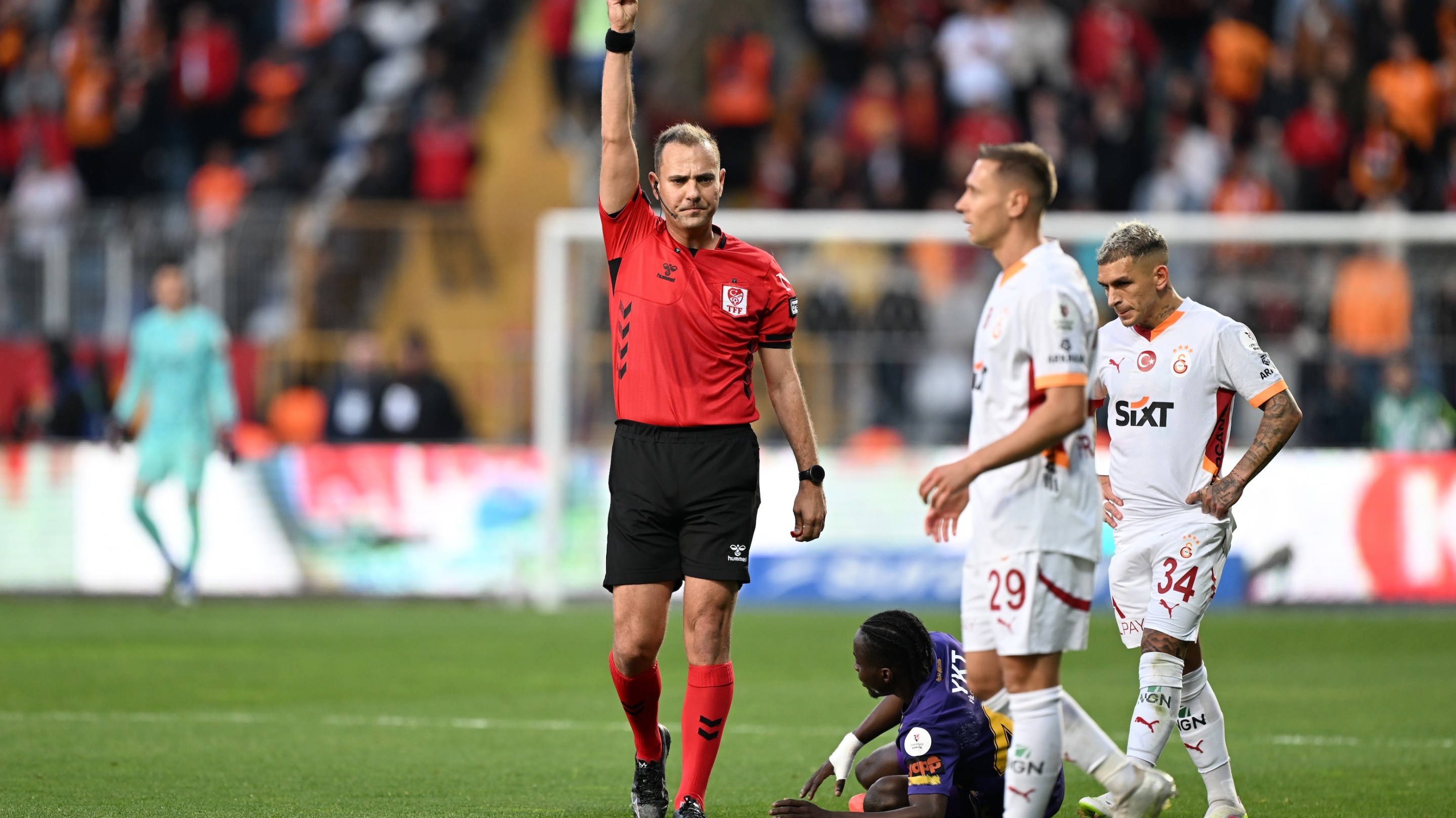 Przemyslaw Adam Frankowski (29) of Galatasaray receives yellow card during Turkish Super Lig week 33 football match between ikas Eyupspor and Galatasaray at Recep Tayyip Erdogan Stadium in Istanbul, Turkiye on April 27, 2025.