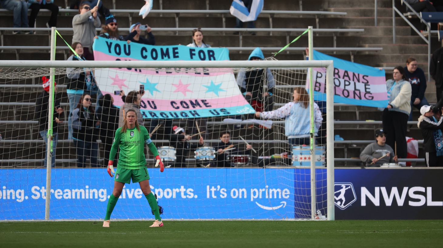 Chicago Stars FC fans chant Trans Rights are Human Rights while holding up a Transgender flag behind Alyssa Naeher #1 of Chicago Stars FC during the first half during a game between San Diego Wave FC and Chicago Stars FC at Seatgeek Stadium on April 26, 2025, in Bridgeview, Illinois.
