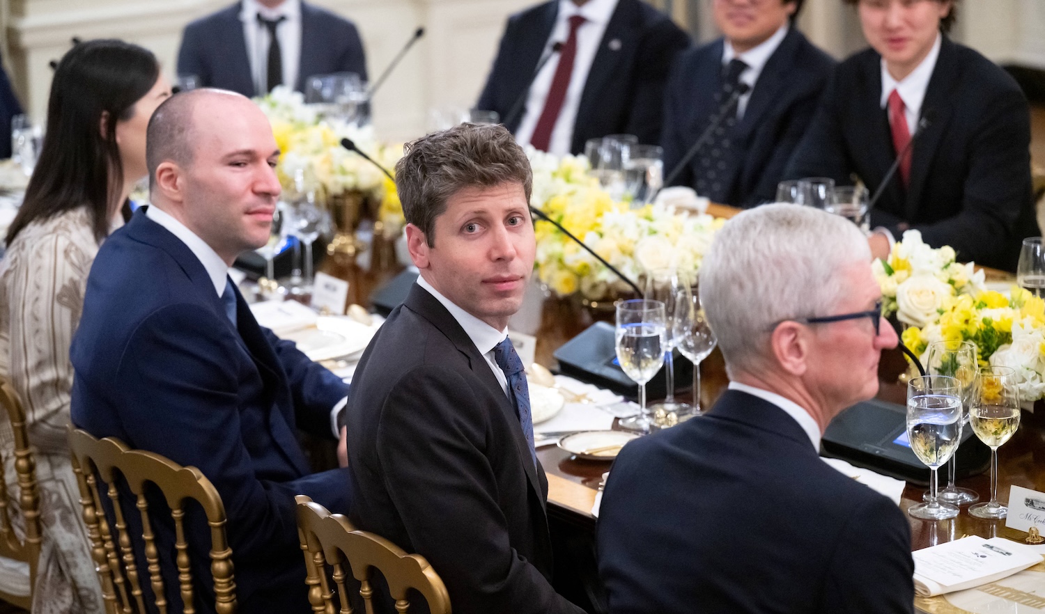 Tech leaders, including Sam Altman (C), CEO of OpenAI, and Tim Cook (2nd L), CEO of Apple, attend a dinner hosted by US President Donald Trump with tech leaders in the State Dining Room of the White House in Washington, DC, on September 4, 2025. (Photo by SAUL LOEB / AFP)