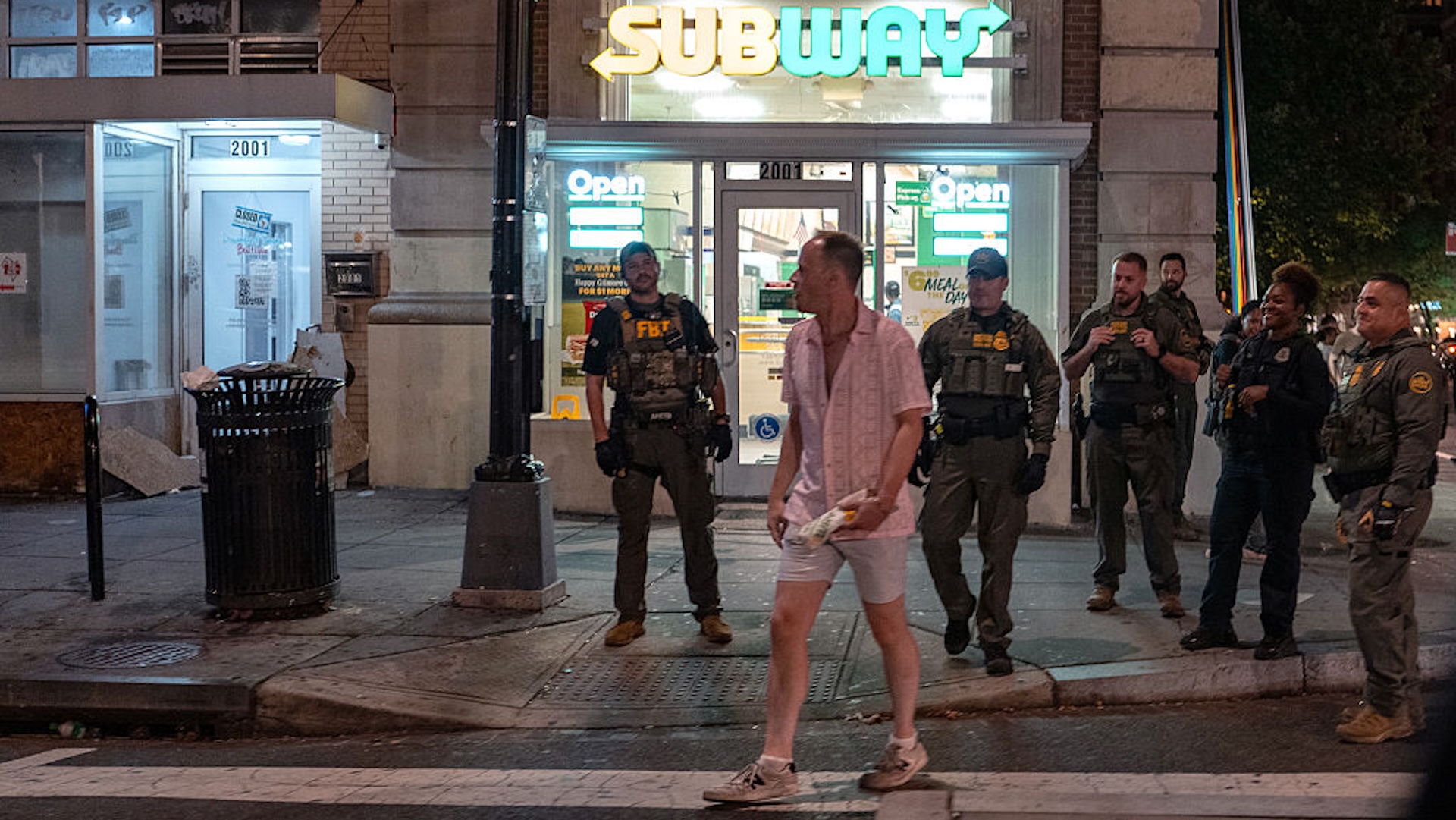 FBI and Border Patrol officers arrest Sean Charles Dunn, after he allegedly assaulted law enforcement with a sandwich, along the U Street corridor during a federal law enforcement deployment to the nation's capital on August 10, 2025 in Washington, DC. U.S. President Donald Trump ordered an increased presence of federal law enforcement to Washington, DC in an effort to curb crime.
