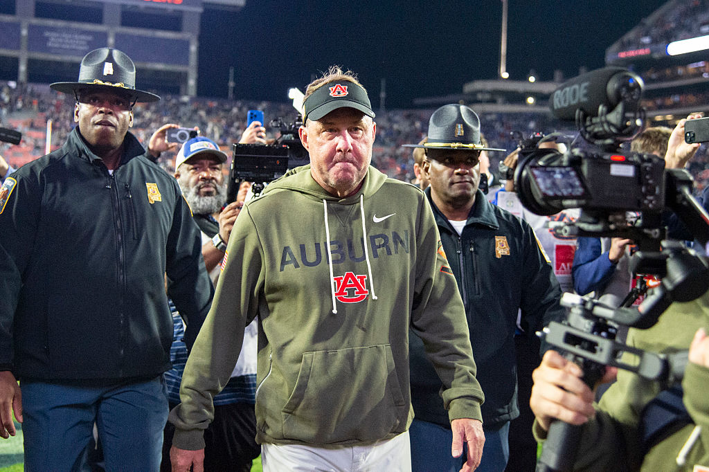 Auburn University head football coach Hugh Freeze walks off the field surrounded by a police escort following the Tigers home loss to Kentucky on November 1, 2025