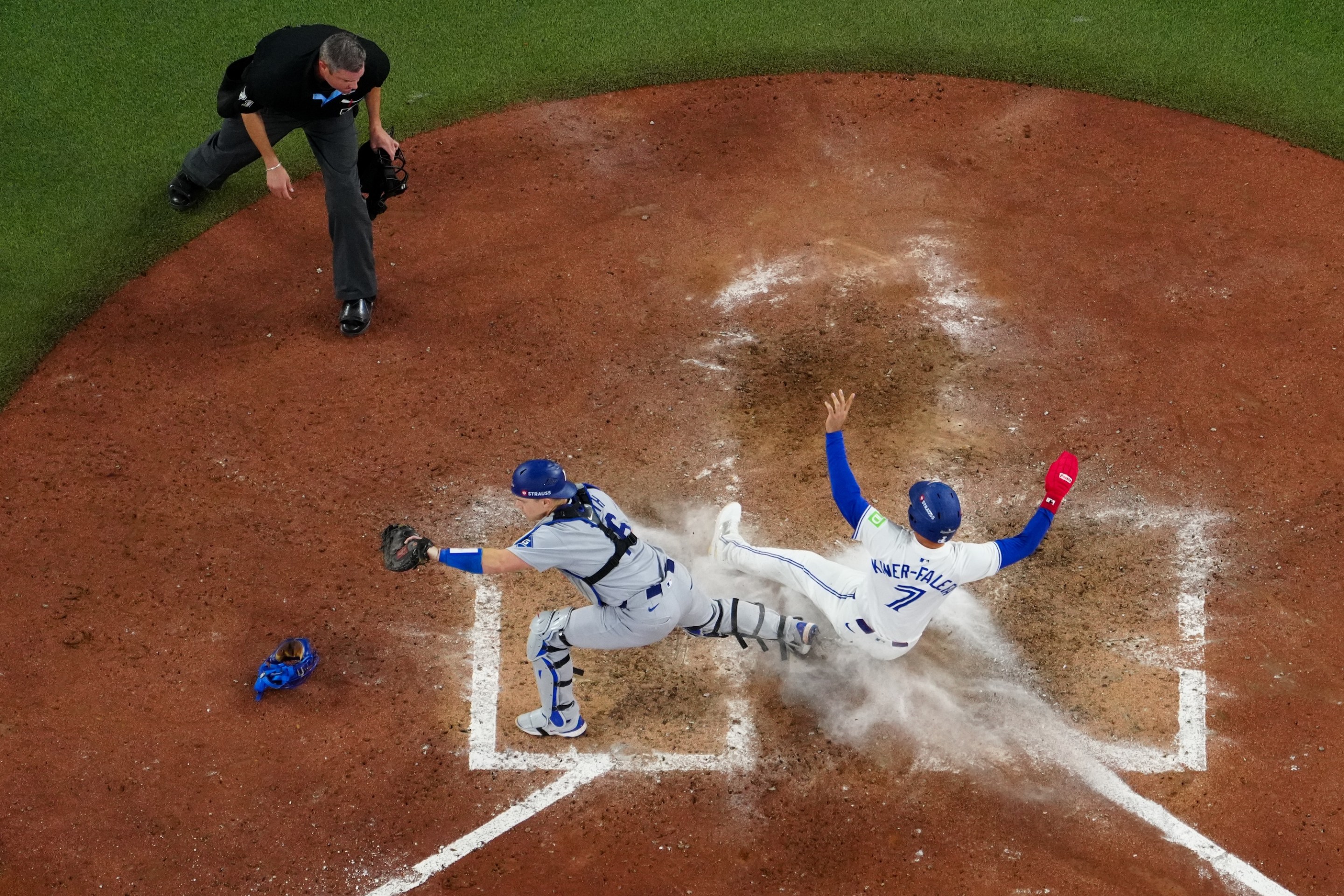 TORONTO, ON - NOVEMBER 01: Will Smith #16 of the Los Angeles Dodgers tags out Isiah Kiner-Falefa #7 of the Toronto Blue Jays at home in the ninth inning during Game Seven of the 2025 World Series presented by Capital One between the Los Angeles Dodgers and the Toronto Blue Jays at Rogers Centre on Saturday, November 1, 2025 in Toronto, Ontario, Canada. (Photo by Daniel Shirey/MLB Photos via Getty Images)