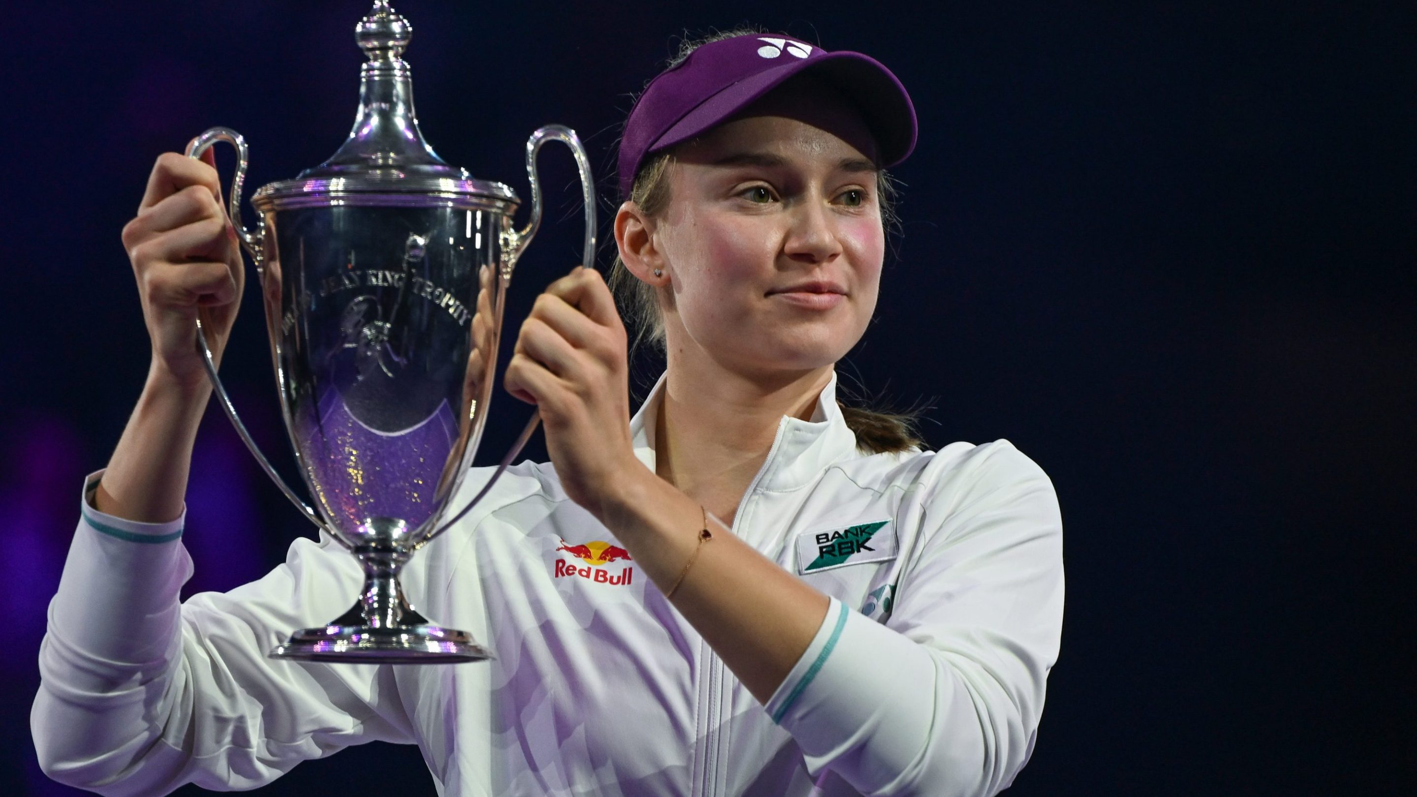 Elena Rybakina of Kazakhstan celebrates with the Billie Jean King Trophy after defeating Aryna Sabalenka at the WTA Finals.