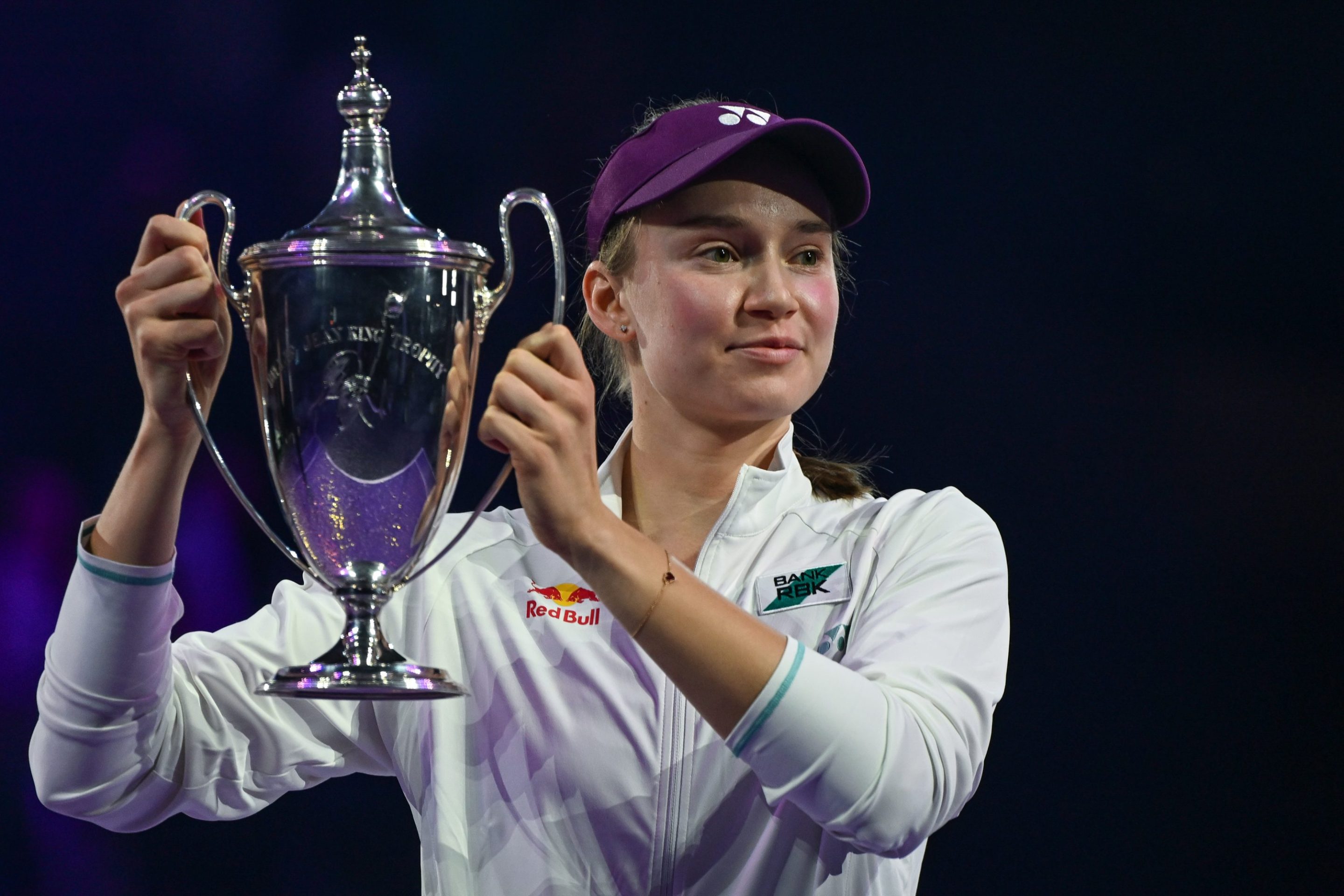 Elena Rybakina of Kazakhstan celebrates with the Billie Jean King Trophy after defeating Aryna Sabalenka at the WTA Finals.