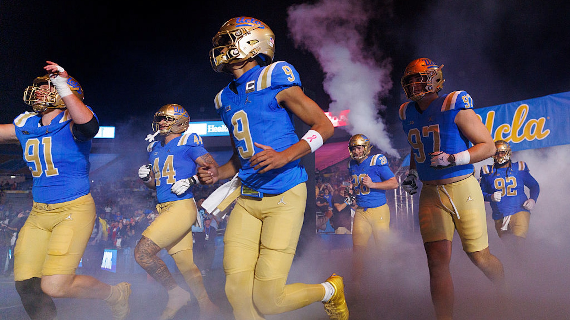 UCLA Bruins quarterback Nico Iamaleava (9) runs onto the field with teammates before the game against Nebraska at the Rose Bowl on November 8, 2025 in Pasadena, California.