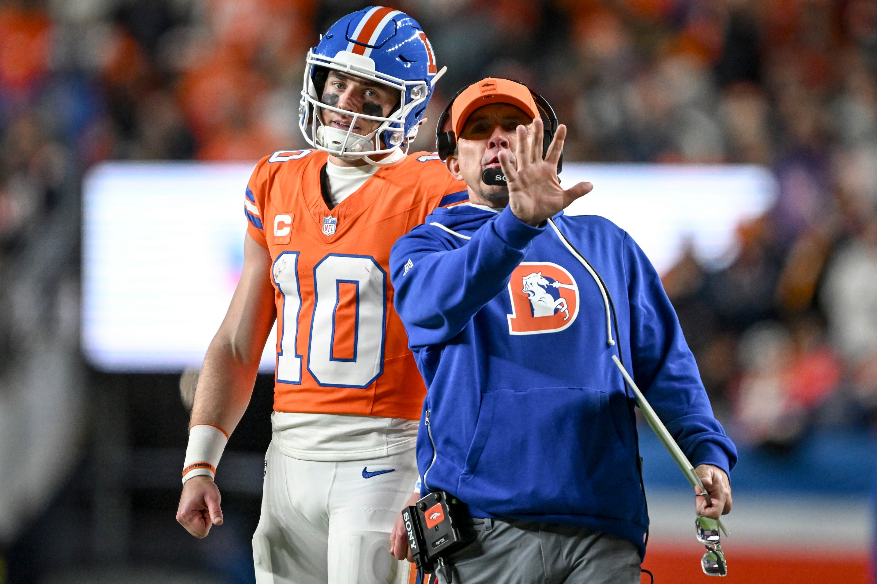 Head coach Sean Payton of the Denver Broncos speaks to Bo Nix (10) after a failed third-down conversion during the third quarter of Denver's awful, awful game against the Raiders on November 6, 2025.