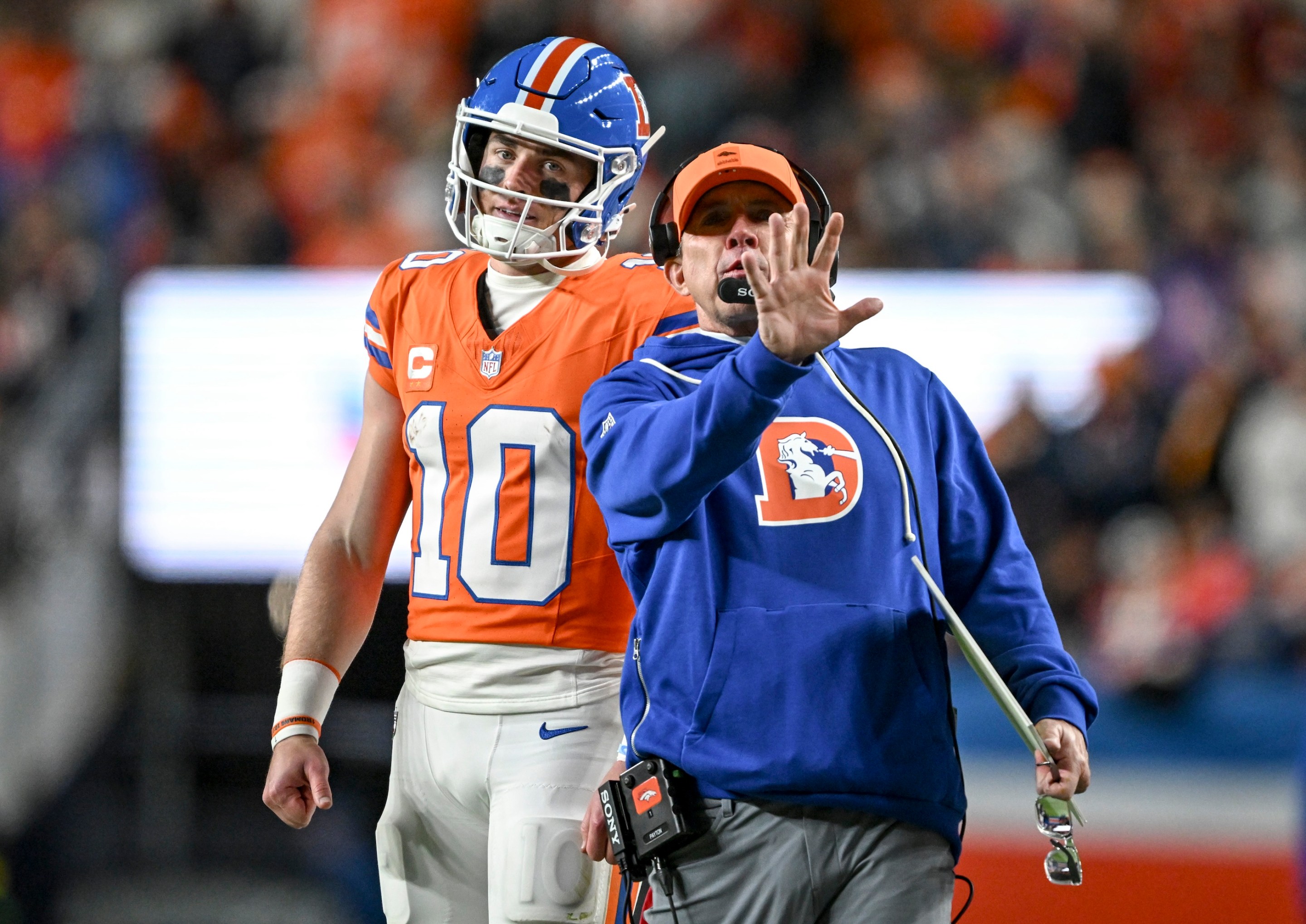 Head coach Sean Payton of the Denver Broncos speaks to Bo Nix (10) after a failed third-down conversion during the third quarter of Denver's awful, awful game against the Raiders on November 6, 2025.