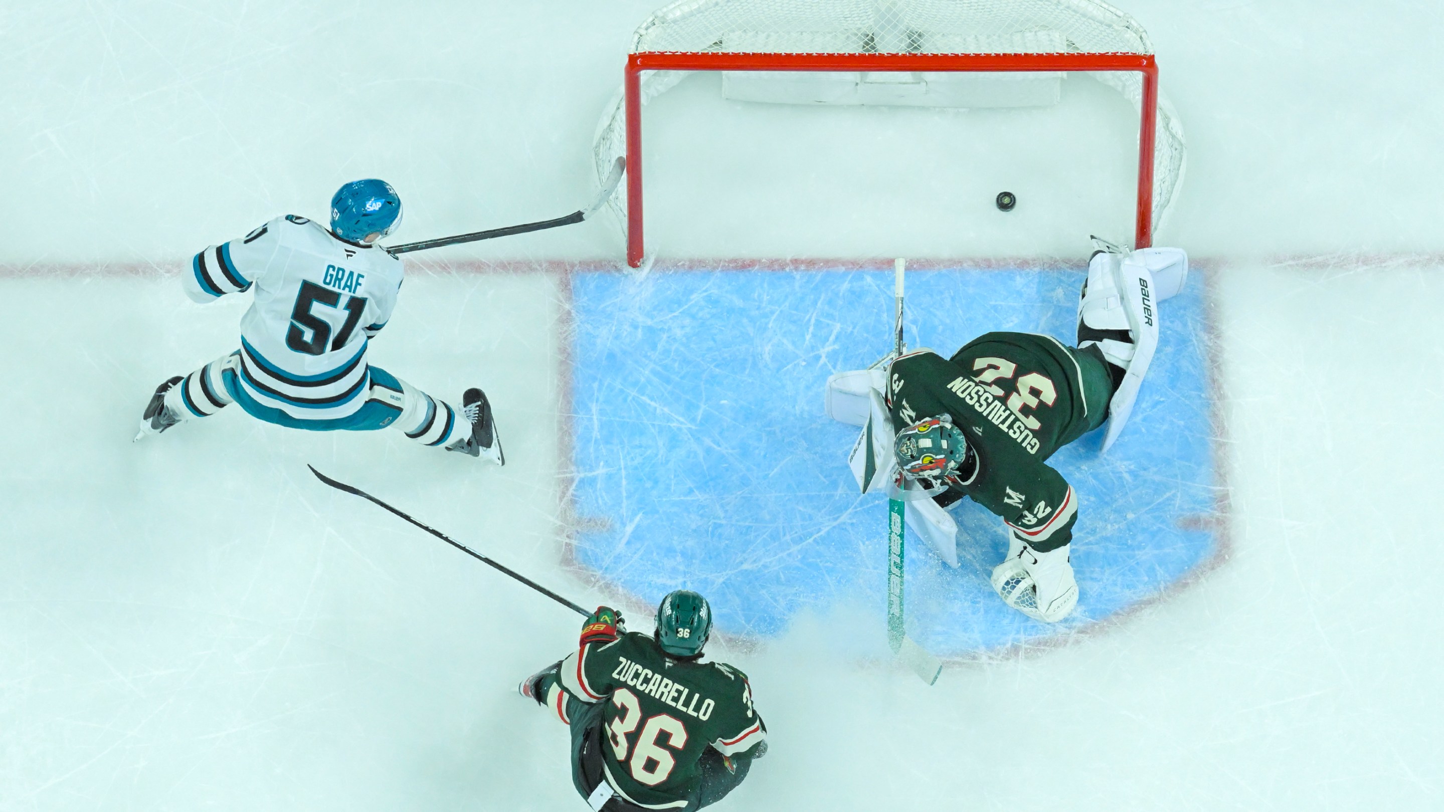 San Jose Sharks forward Collin Graf (51) beats Minnesota Wild goalie Filip Gustavsson (32) for the game-winning goal