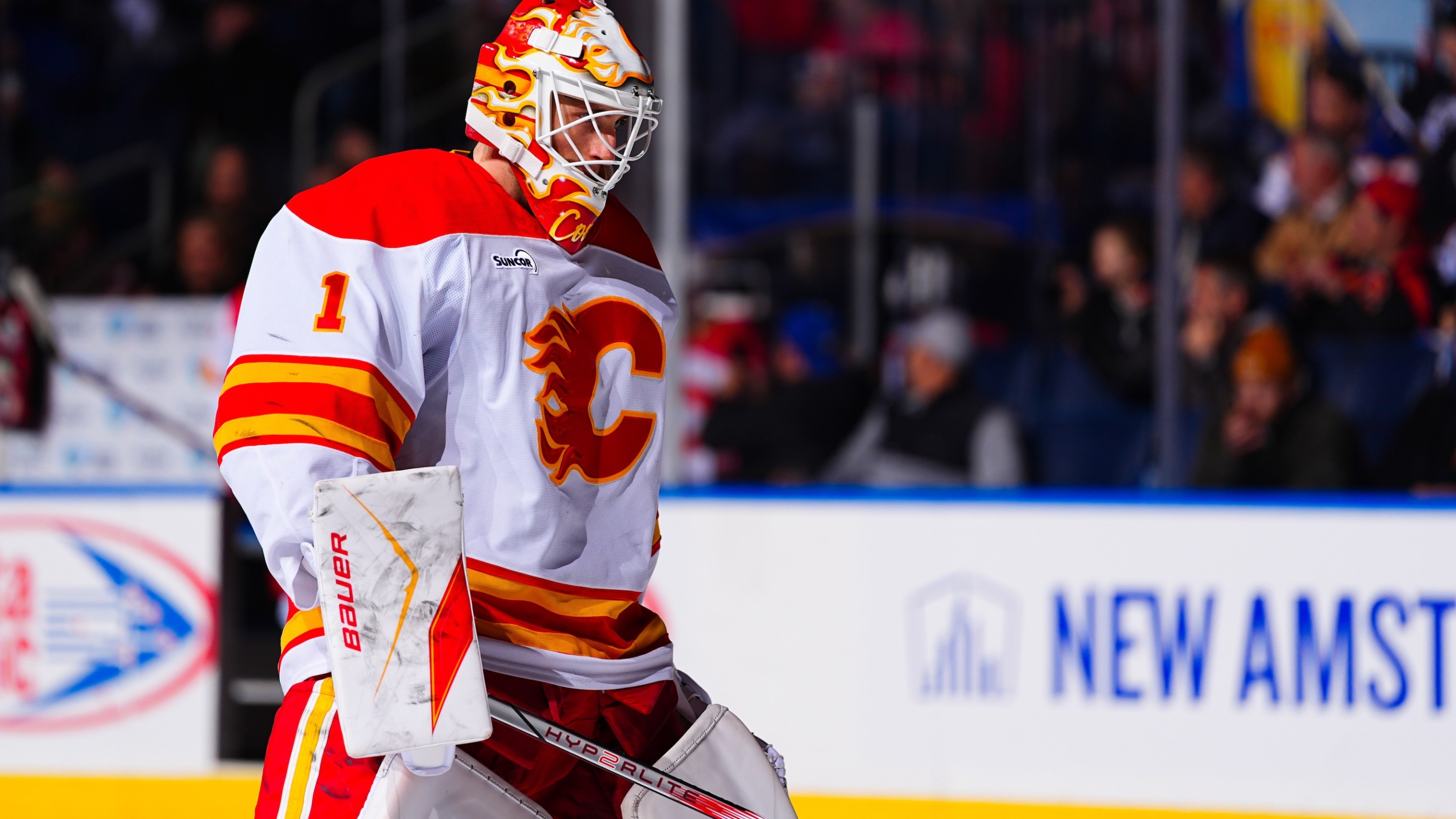 BUFFALO, NEW YORK - NOVEMBER 19: Devin Cooley #1 of the Calgary Flames stands during the singing of 'O Canada' prior to an NHL game on November 19, 2025 at KeyBank Center in Buffalo, New York. (Photo by Ben Ludeman/NHLI via Getty Images)