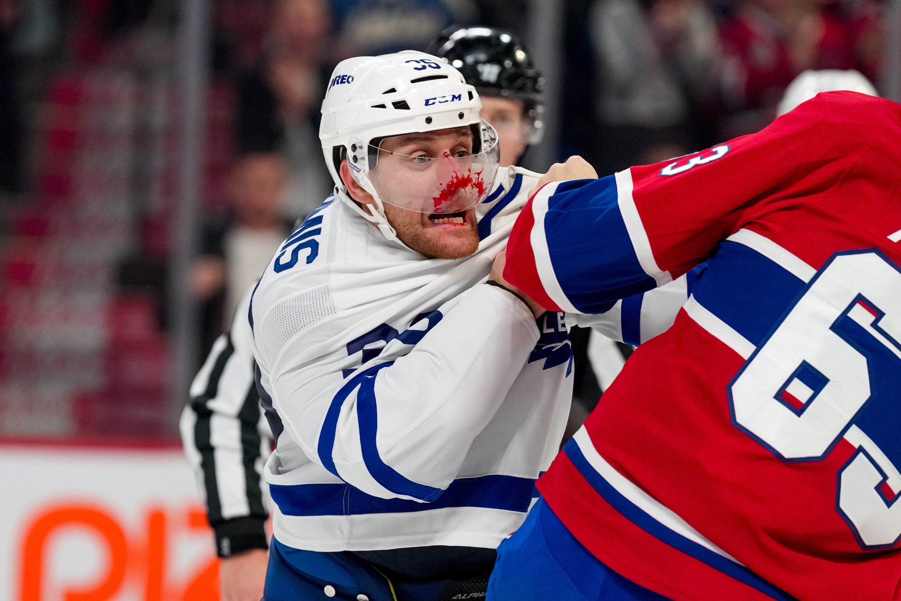 MONTREAL, QUEBEC - NOVEMBER 22: Dakota Mermis #36 of the Toronto Maple Leafs fights Florian Xhekaj #63 of the Montréal Canadiens during the third period at Bell Centre on November 22, 2025 in Montreal, Quebec. (Photo by Reuben Polansky-Shapiro/NHLI via Getty Images)