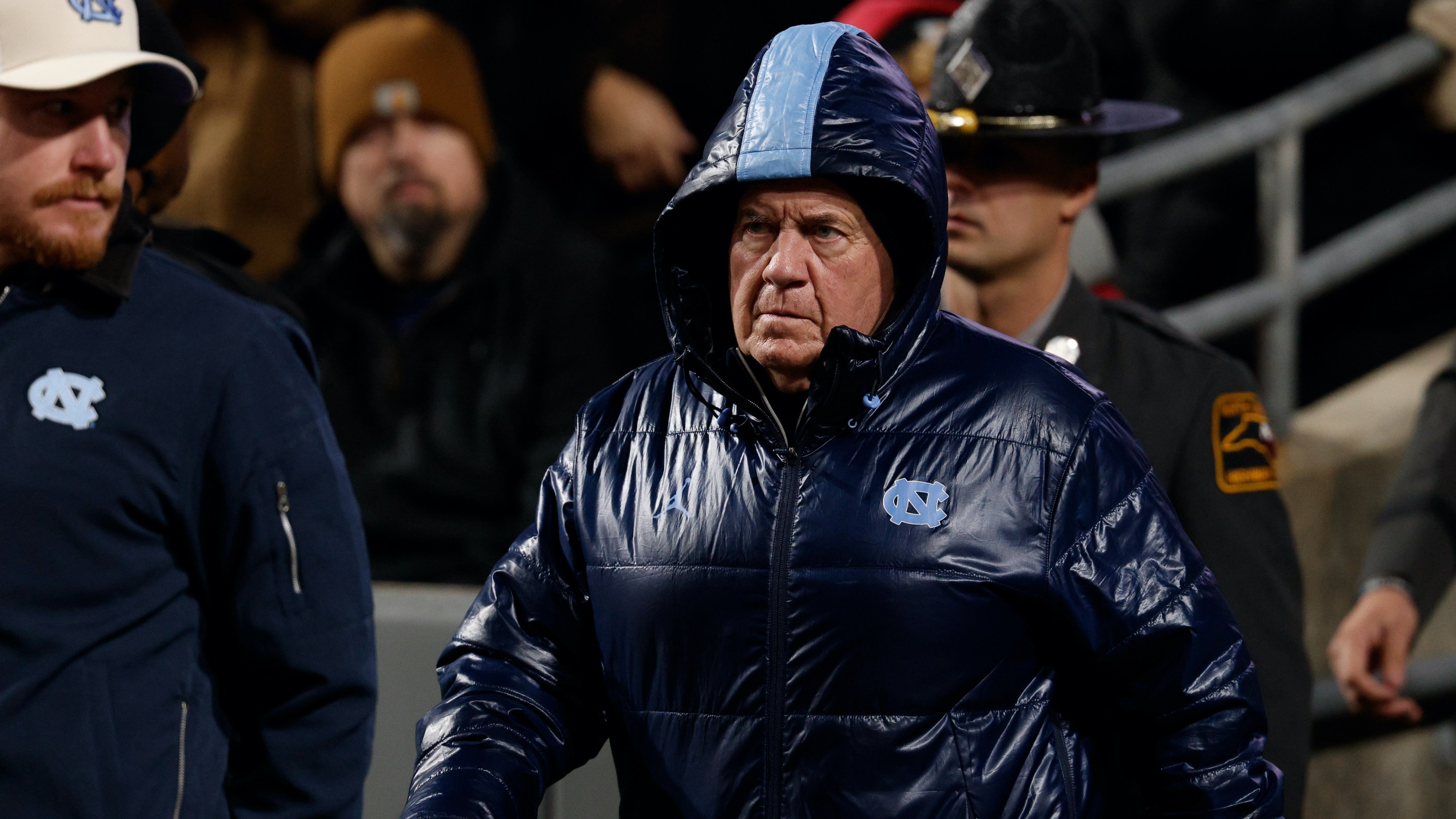 UNC head coach Bill Belichick in a big puffy coat