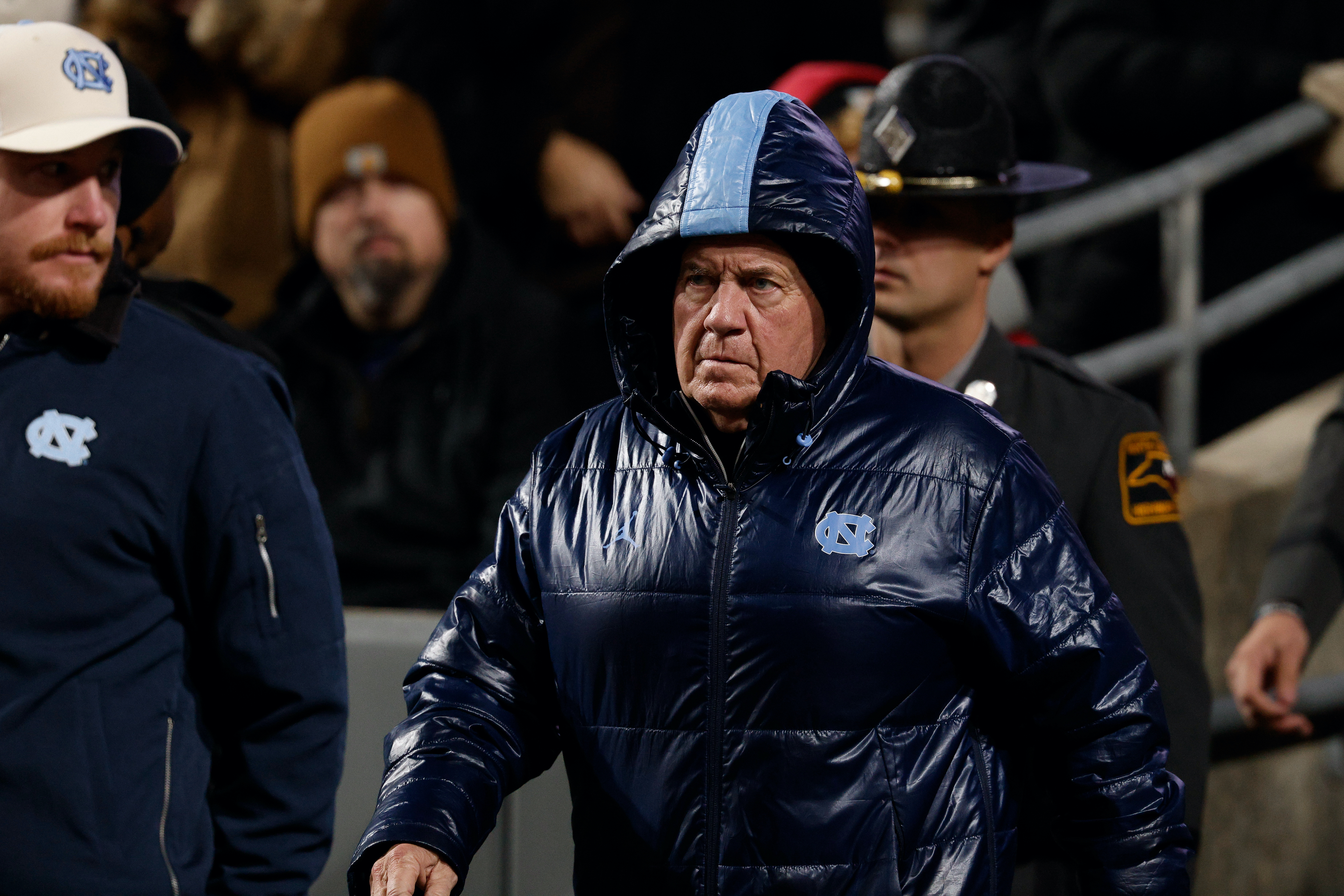 UNC head coach Bill Belichick in a big puffy coat