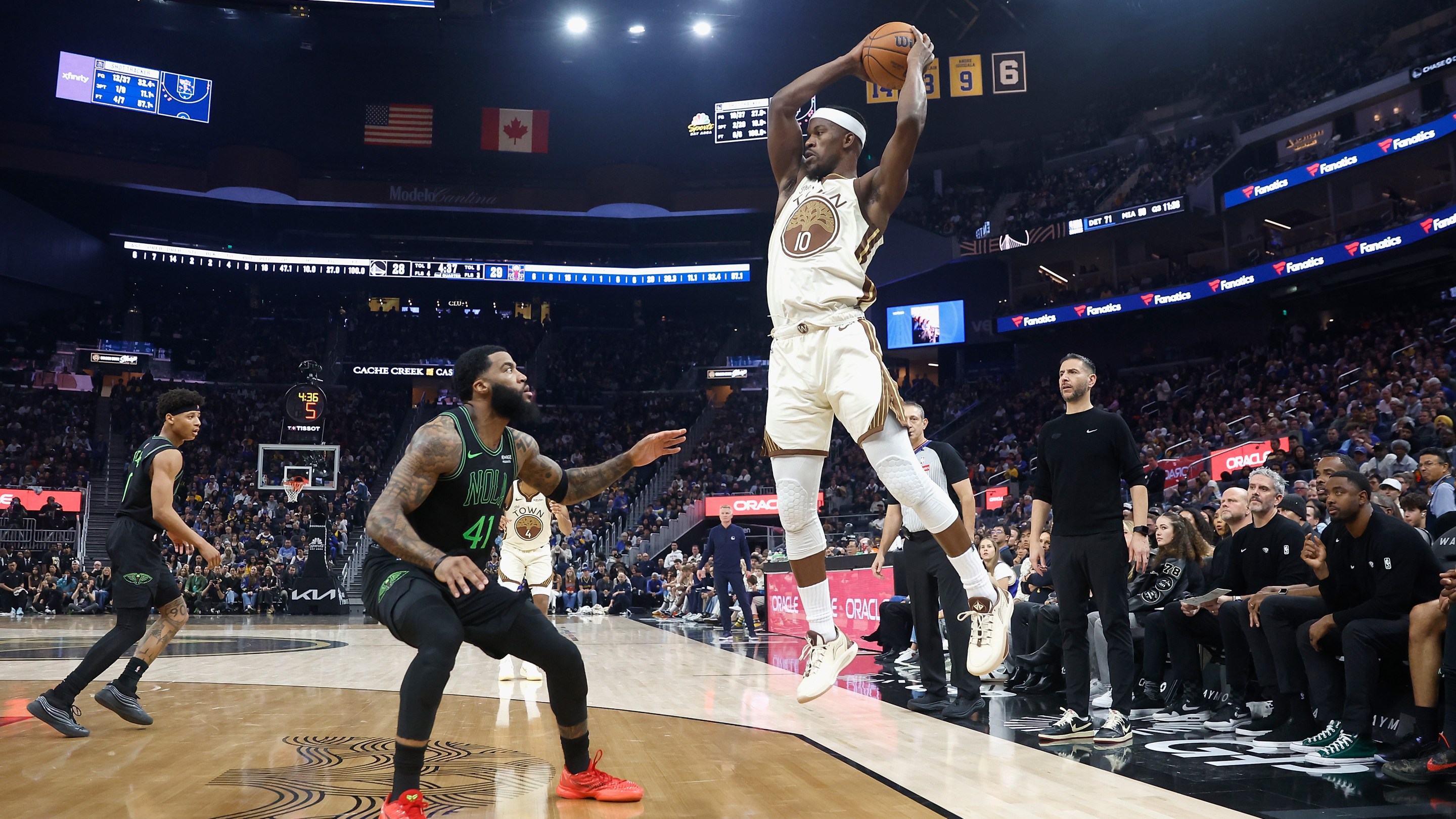 Jimmy Butler III #10 of the Golden State Warriors looks to pass the ball against Saddiq Bey #41 of the New Orleans Pelicans