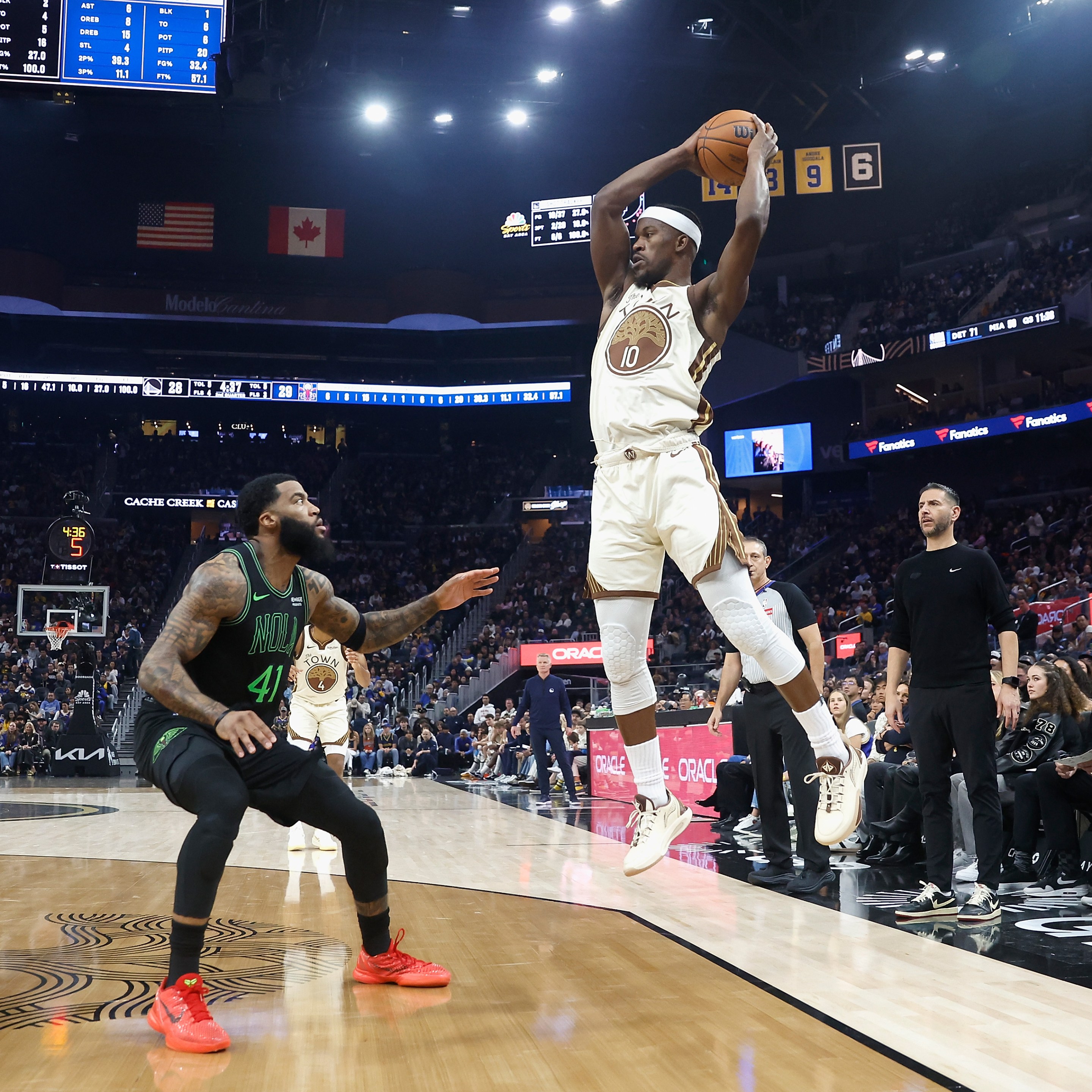 Jimmy Butler III #10 of the Golden State Warriors looks to pass the ball against Saddiq Bey #41 of the New Orleans Pelicans