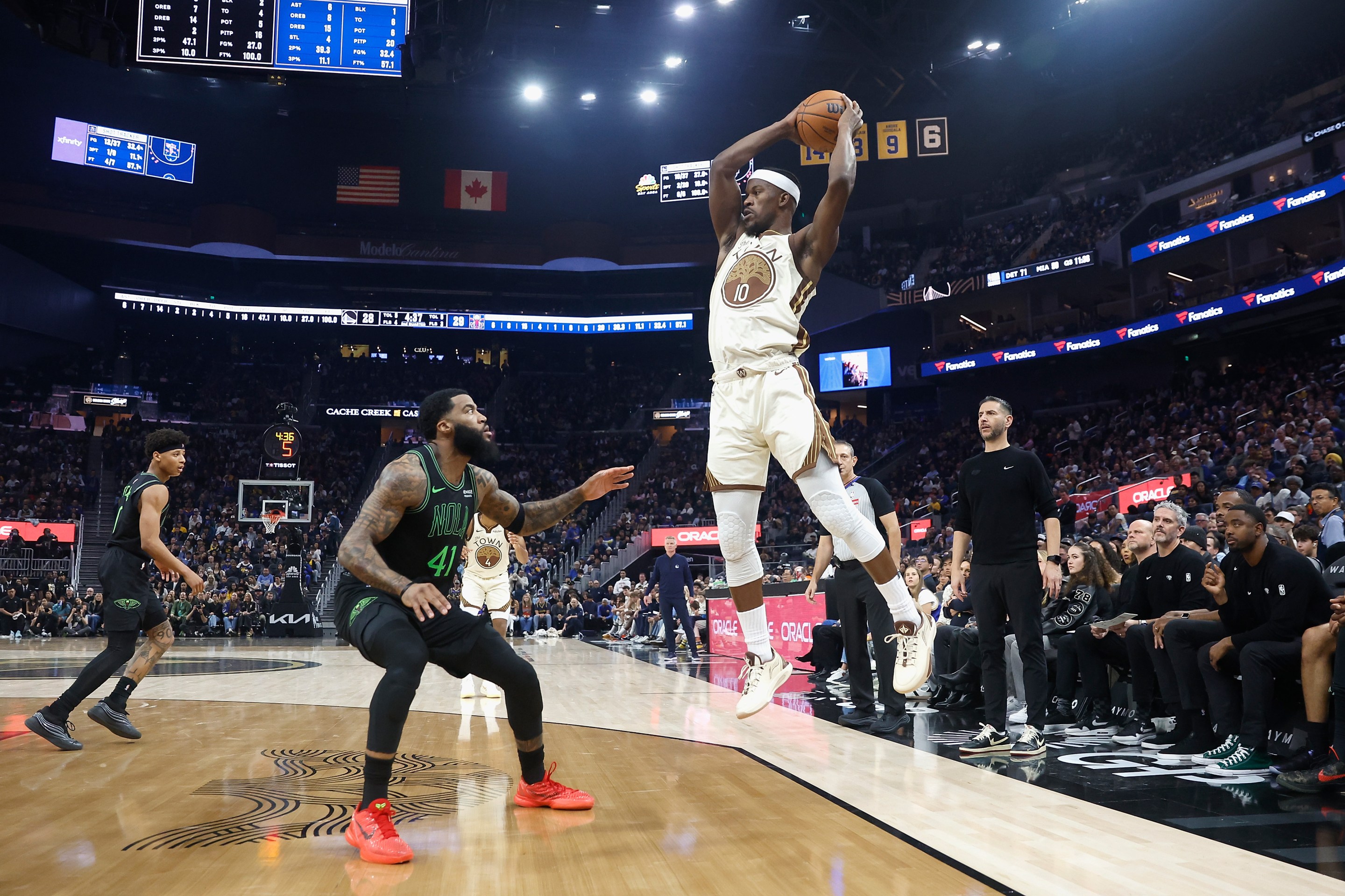 Jimmy Butler III #10 of the Golden State Warriors looks to pass the ball against Saddiq Bey #41 of the New Orleans Pelicans