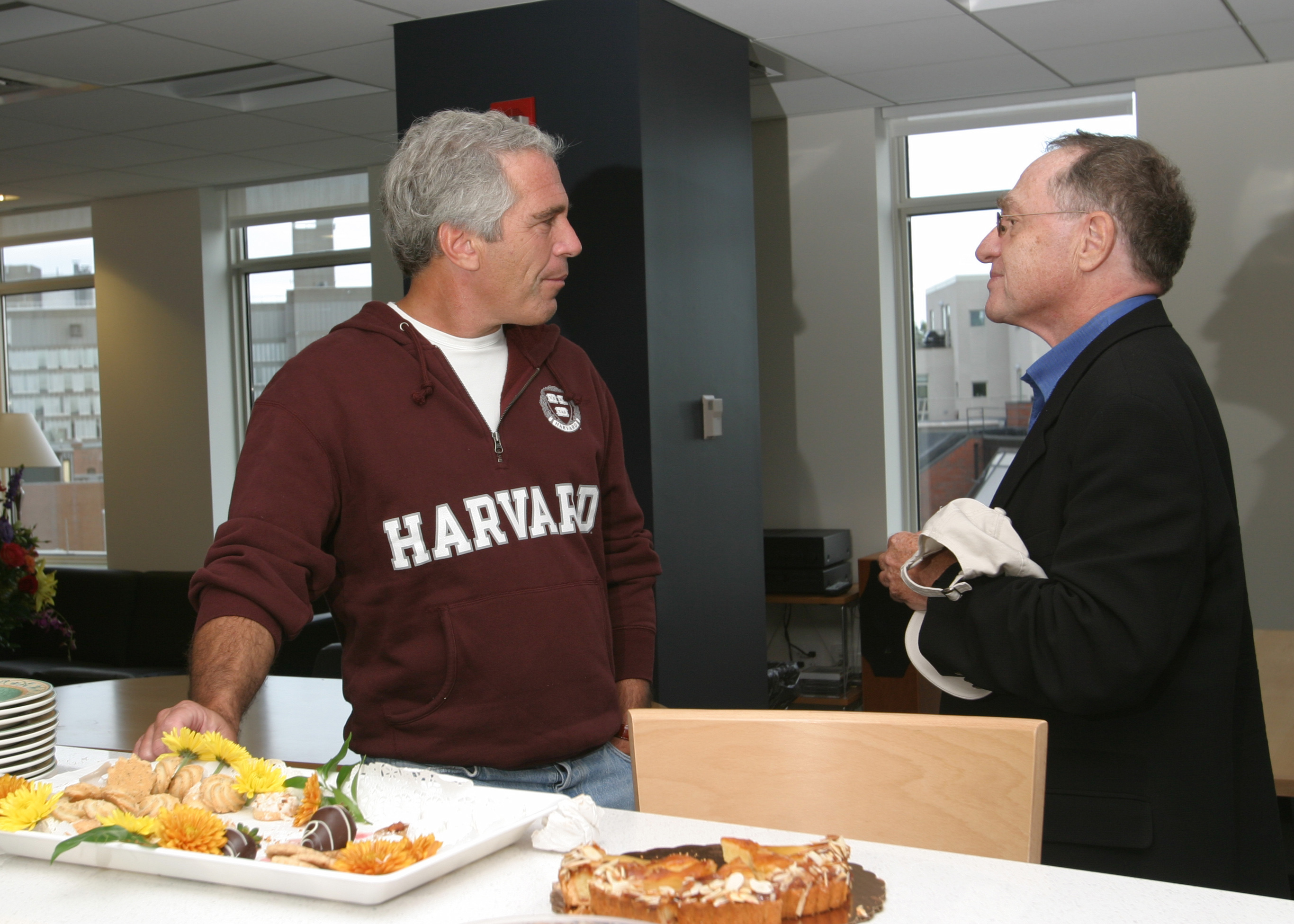 Jeffrey Epstein and Alan Dershowitz discuss something.