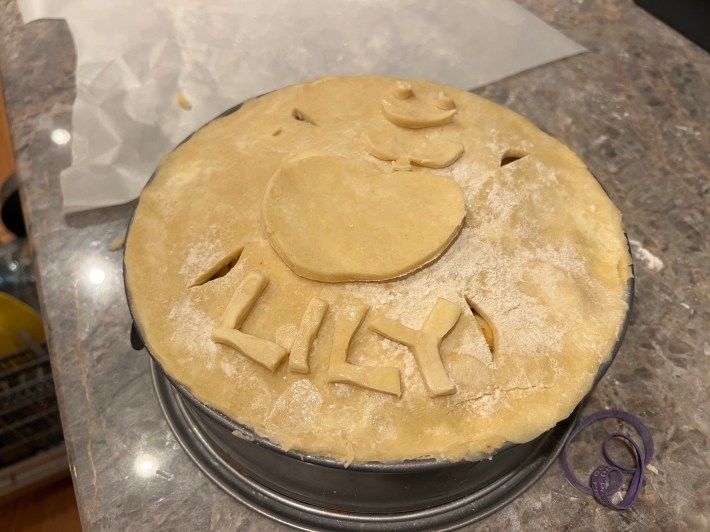The top dough pressed onto the pie, pre-bake.
