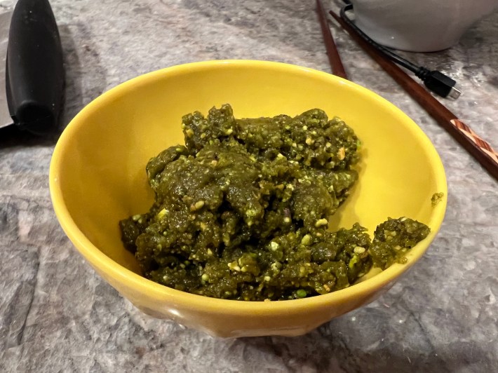 A brown sticky crumble of pistachio paste.