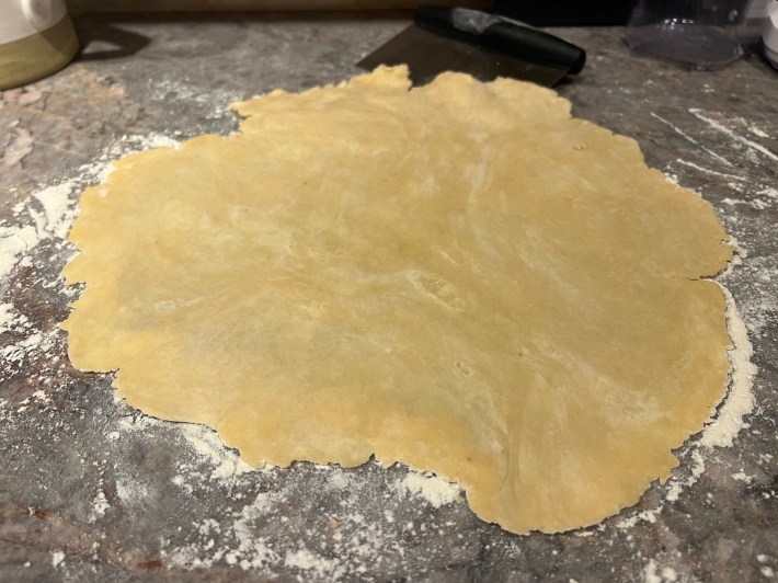 Dough rolled out into a flat sheet.
