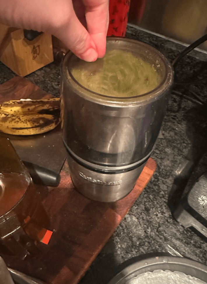 spice grinder whirring with spices inside