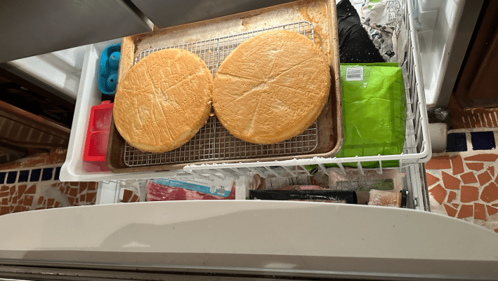 two cakes inside a freezer