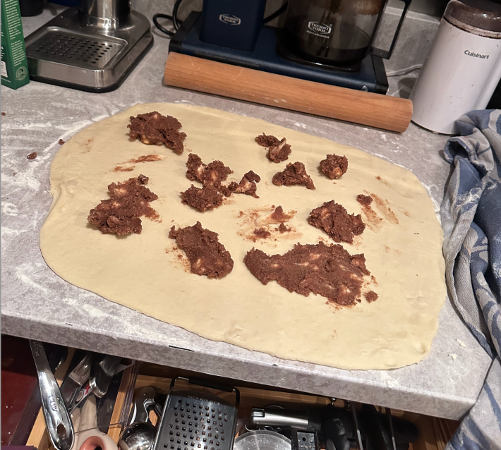 wads of brown goop across dough