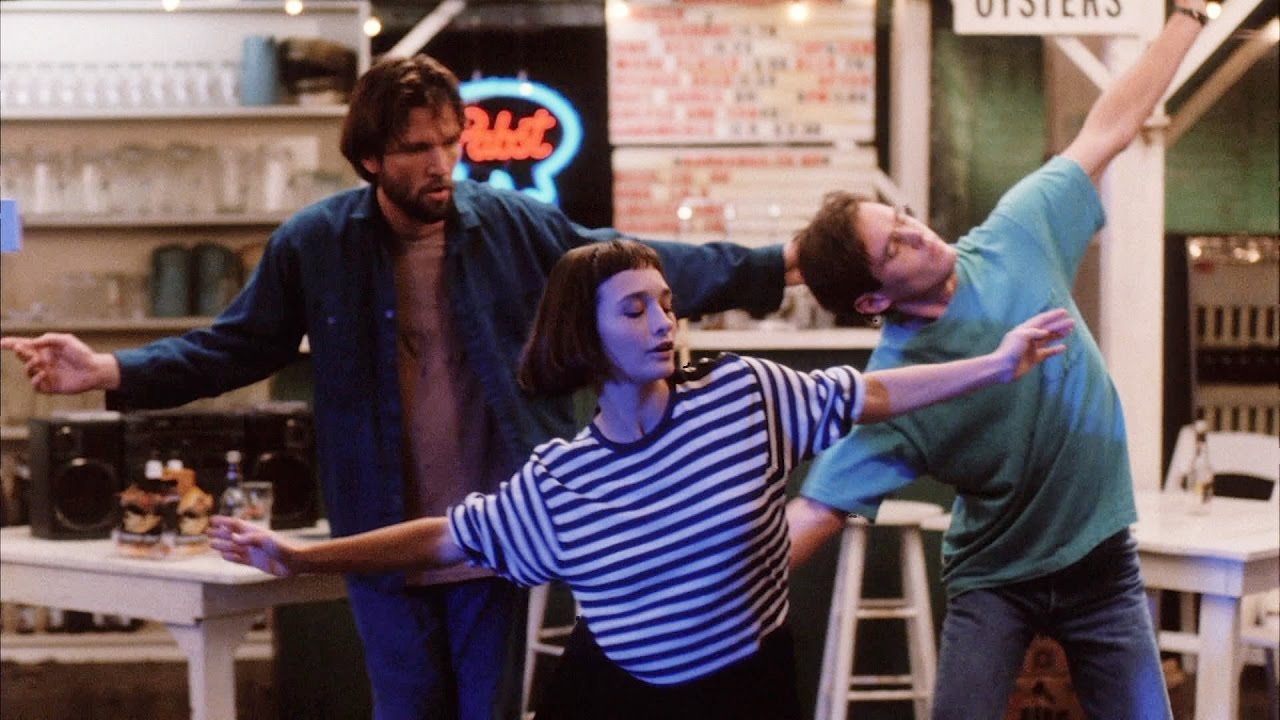 Martin Donovan, Elina Lowensohn, and Bill Sage, left to right, dance in an empty restaurant in a scene from Hal Hartley's film "Simple Men."