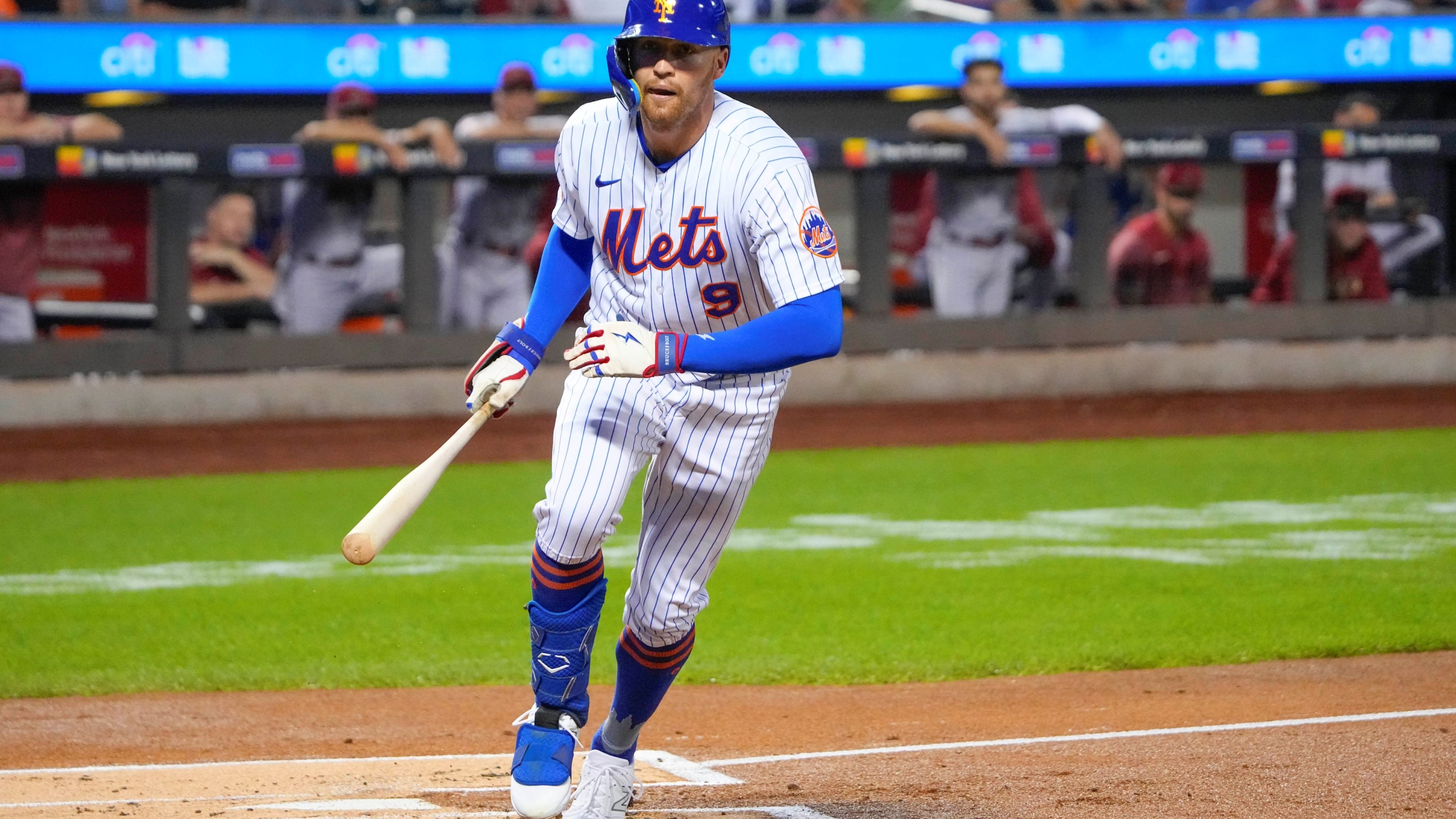 New York Mets outfielder Brandon Nimmo (9) sprinting to first base on a walk.