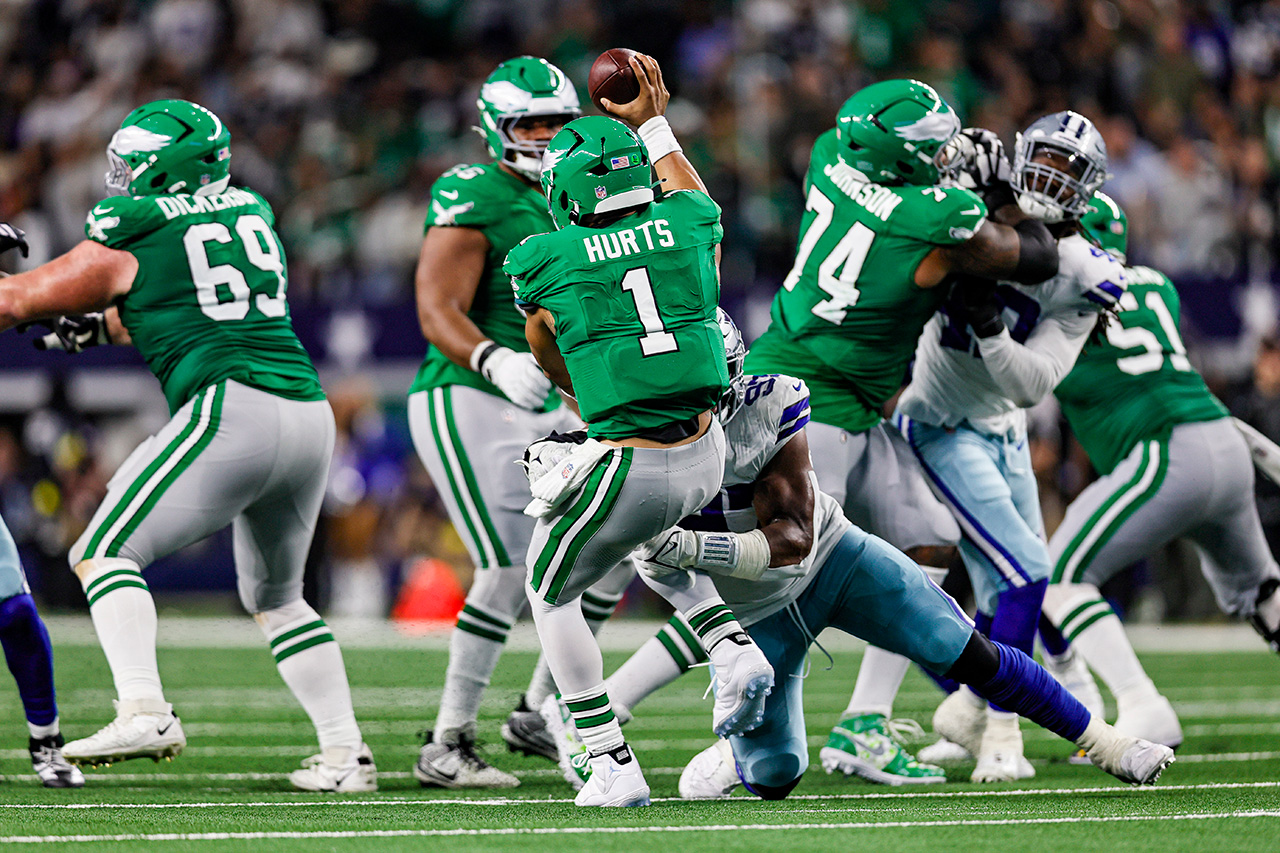 ARLINGTON, TX - NOVEMBER 23: Dallas Cowboys defensive tackle Osa Odighizuwa (97) sacks Philadelphia Eagles quarterback Jalen Hurts (1) during the game between the Dallas Cowboys and the Philadelphia Eagles on November 23, 2025 at AT&T Stadium in Arlington, Texas.