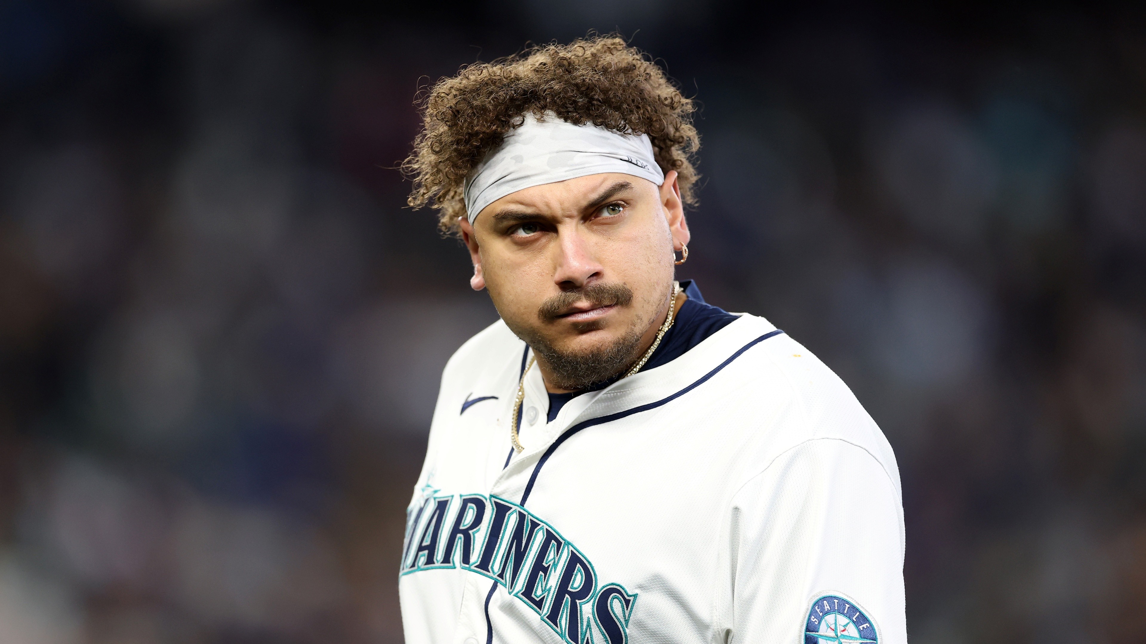 osh Naylor #12 of the Seattle Mariners reacts after grounding out to end the first inning.